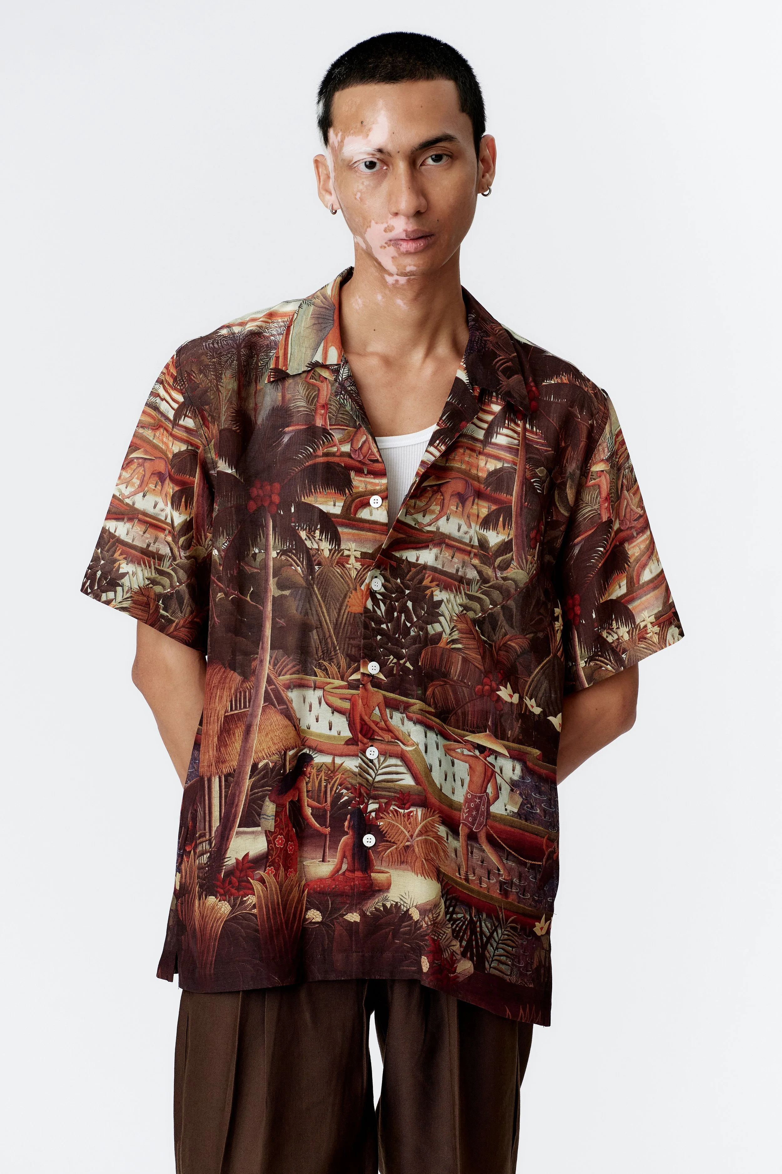Three-quarter front view of Subak brown camp collar shirt in 60% silk 40% rayon