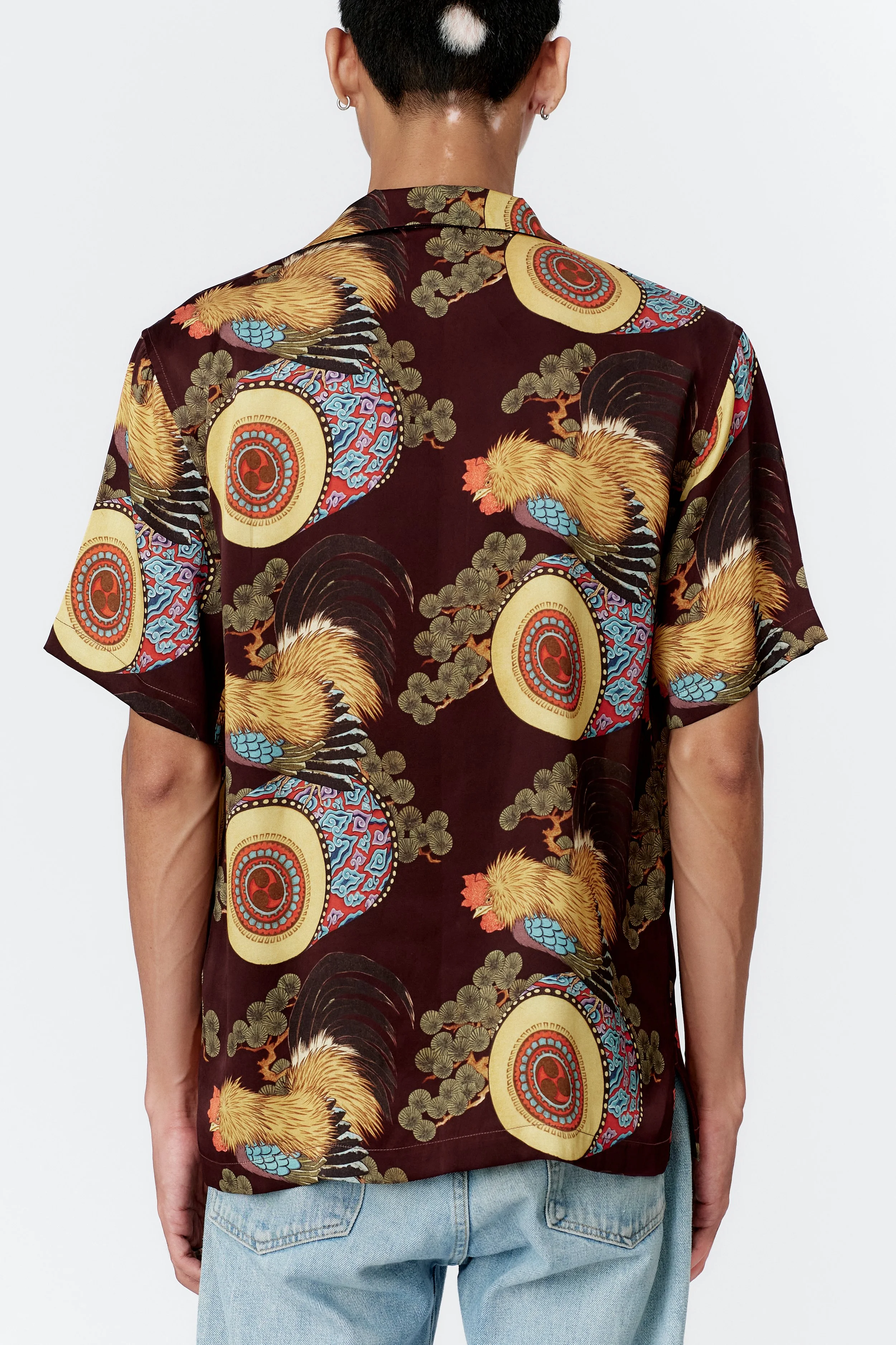 Back close-up view of model wearing wine silk satin shirt.