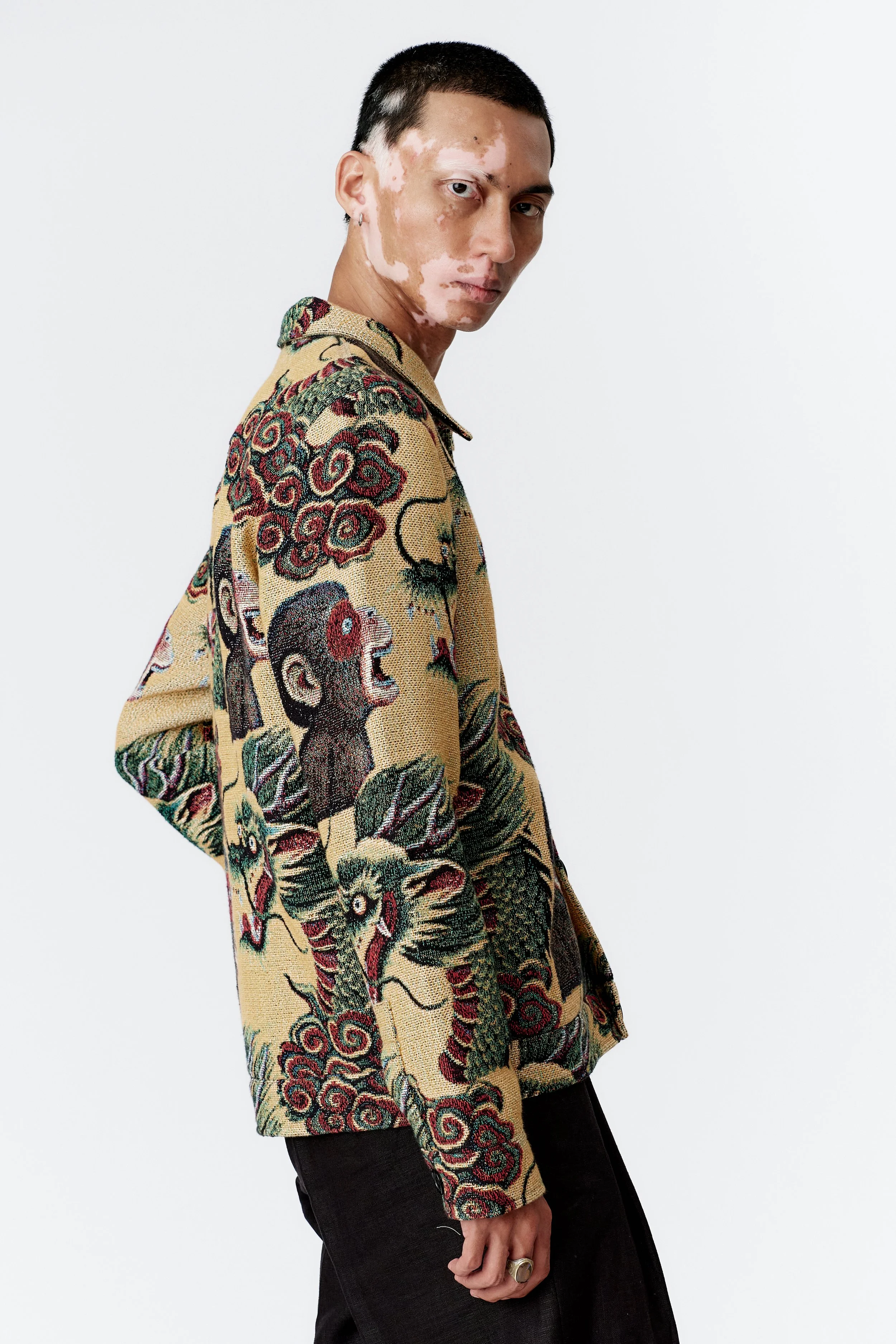 Side sleeve profile showing woven dragon detail