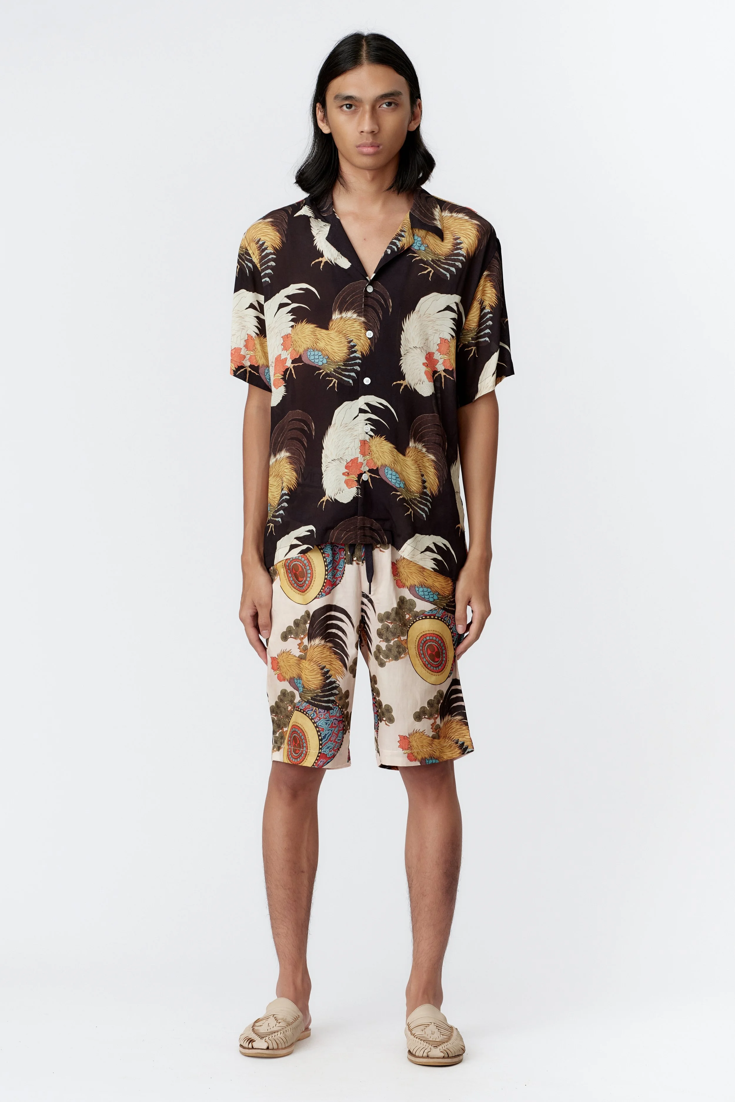 Full view of model wearing Roosters black two roosters on black background