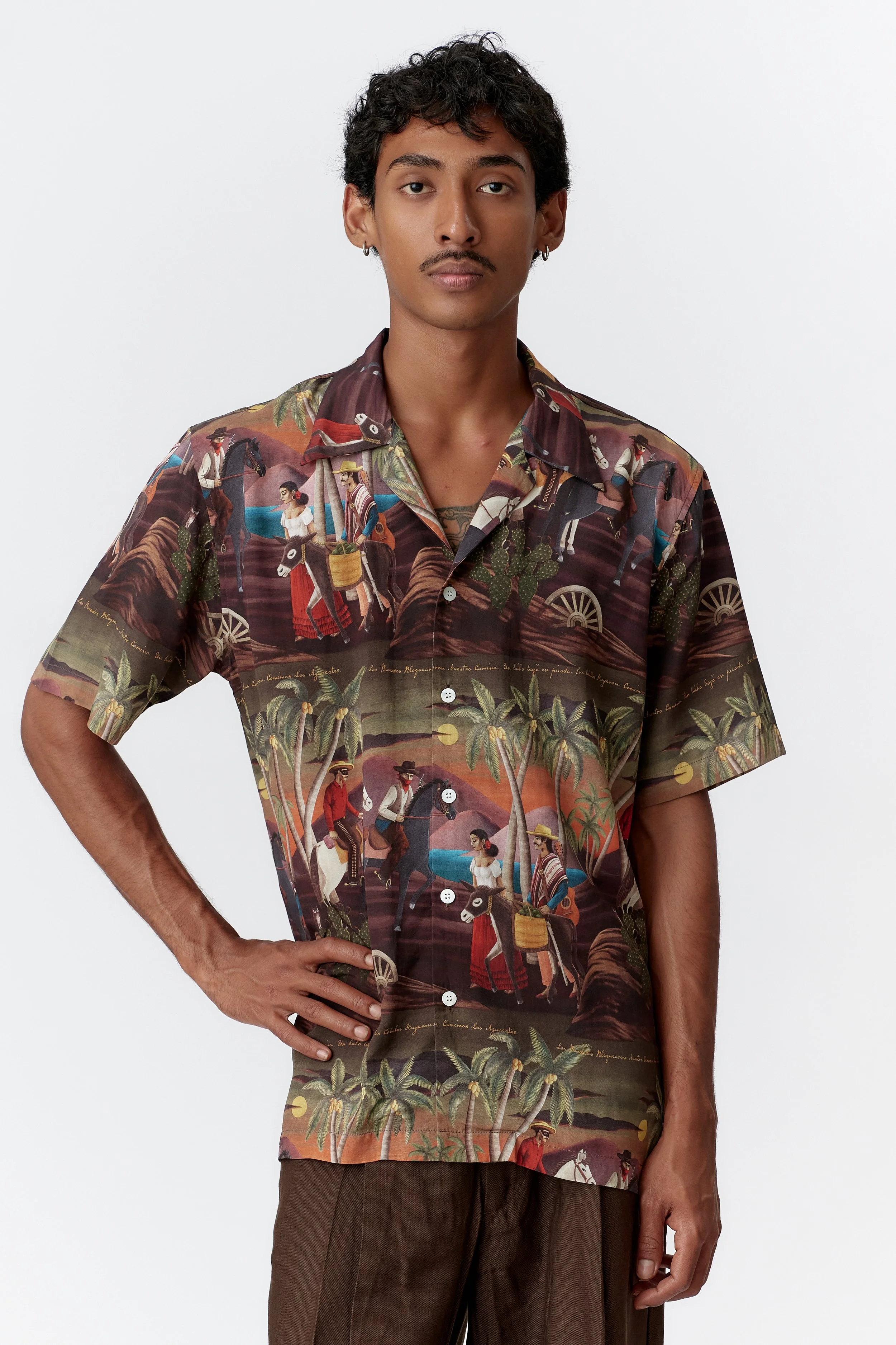 Close-up of camp collar and mother of pearl buttons on Bandito Repeat Bottle Green shirt