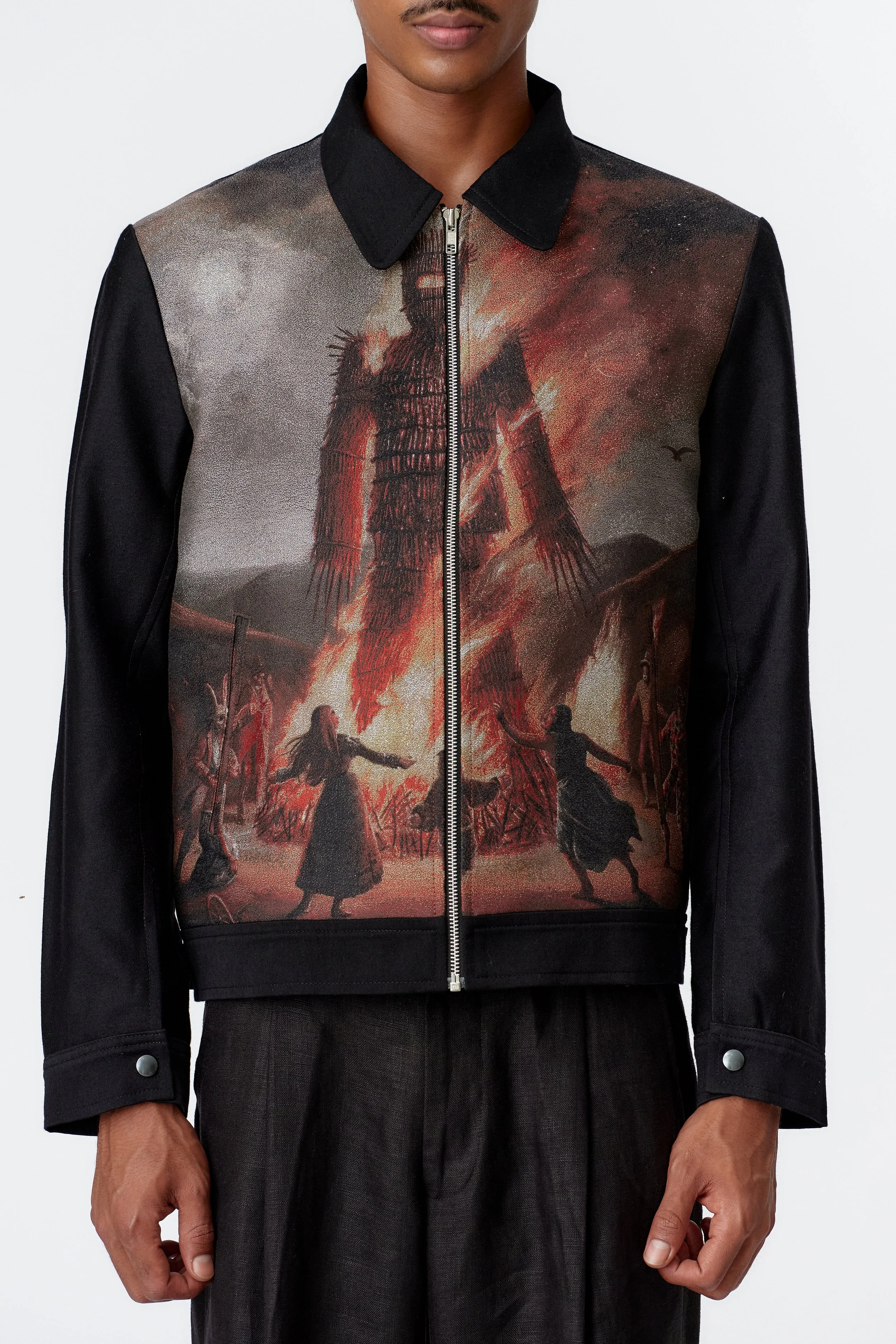 Close-up of premium fabric and texture on black blouson jacket with artwork panel
