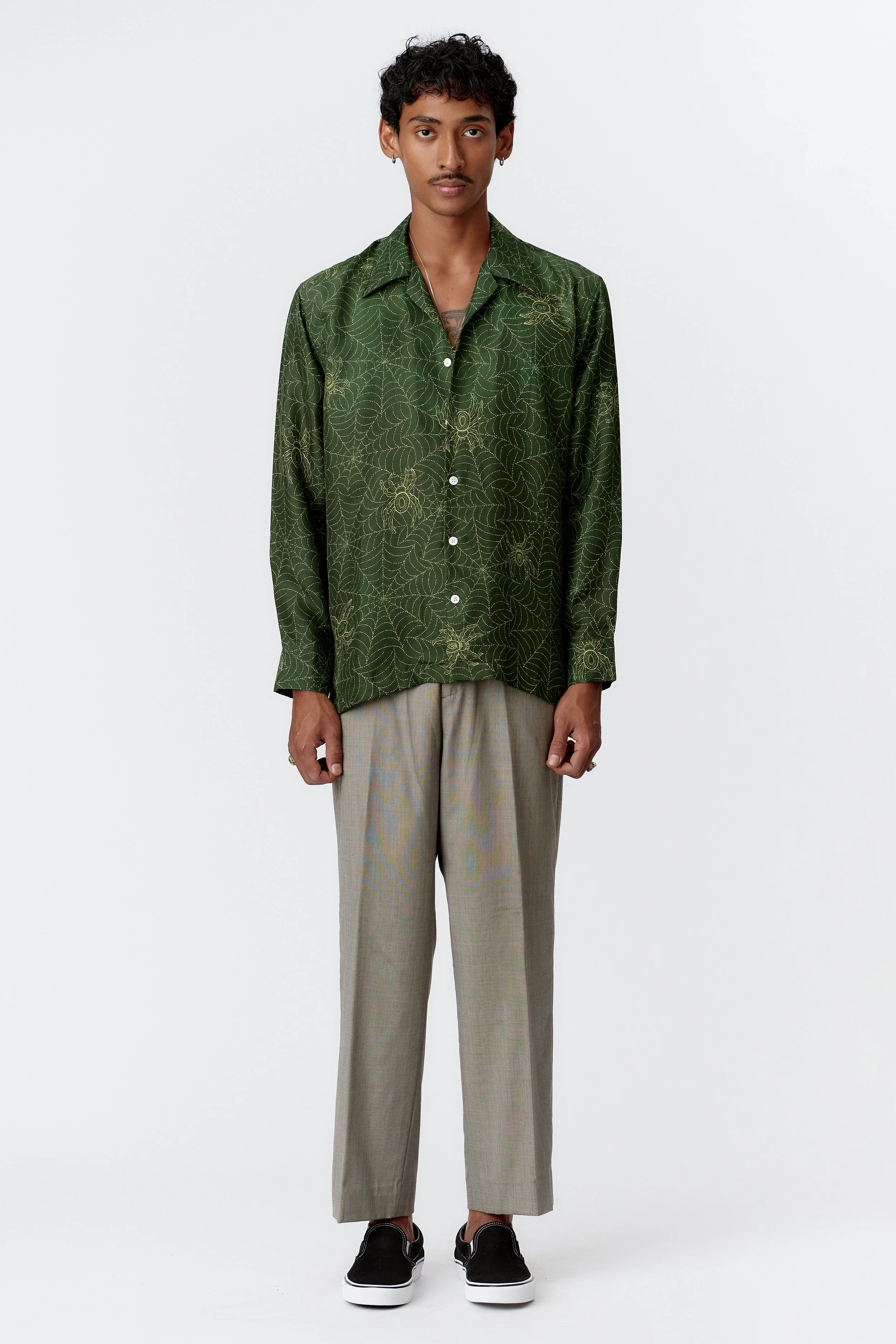 Full body view of model wearing Spiderweb green silk cotton shirt with relaxed drape