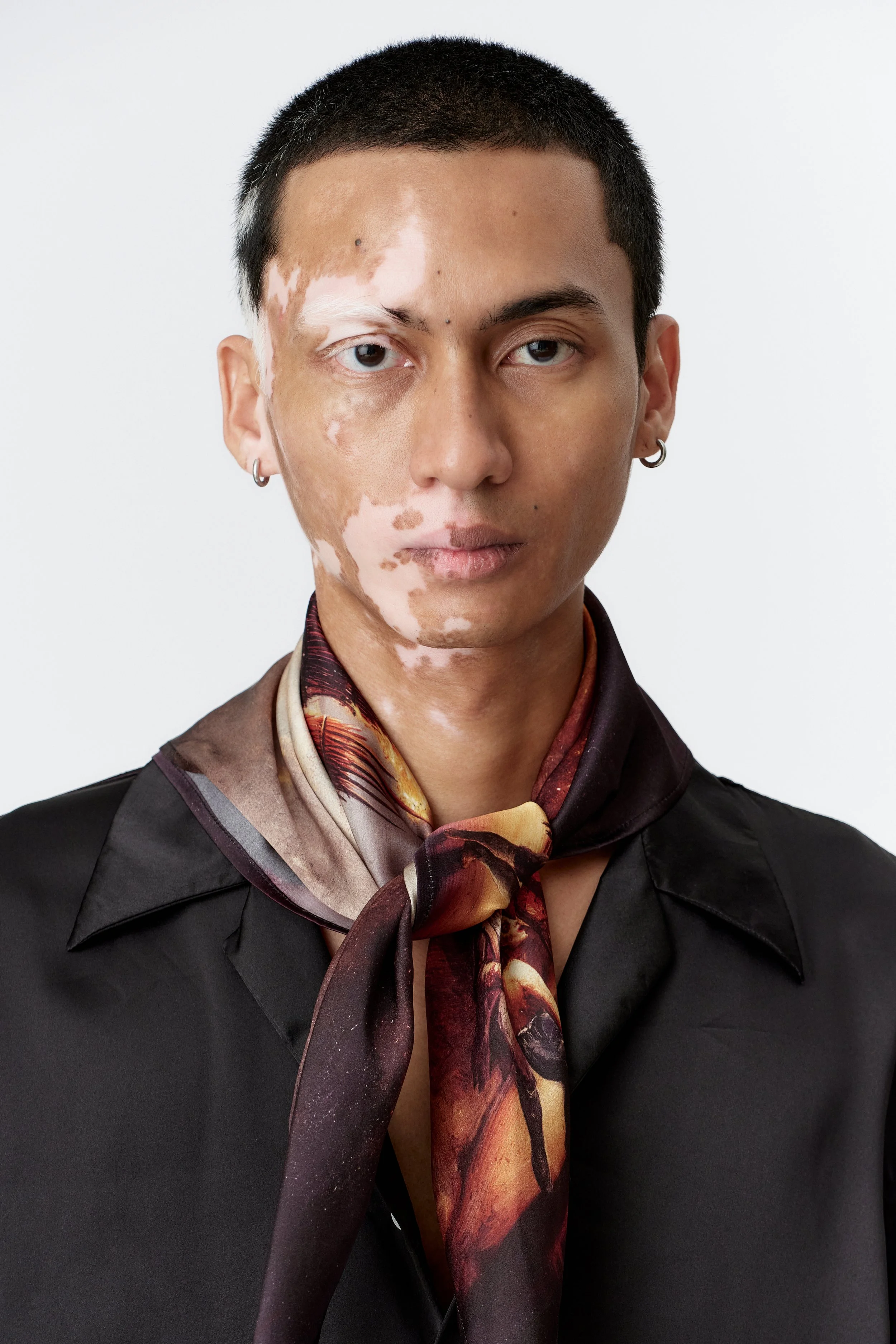 Wickerman painting in silk satin worn around models neck