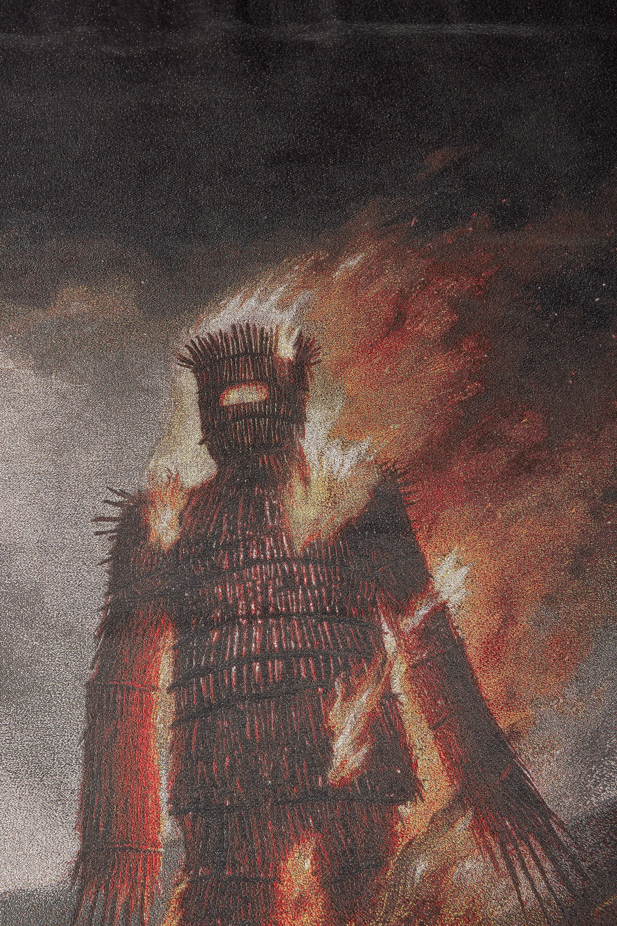 Close up of the burning wicker effigy from the Wickerman limited edition tapestry, highlighting rich woven texture and dramatic folklore imagery.