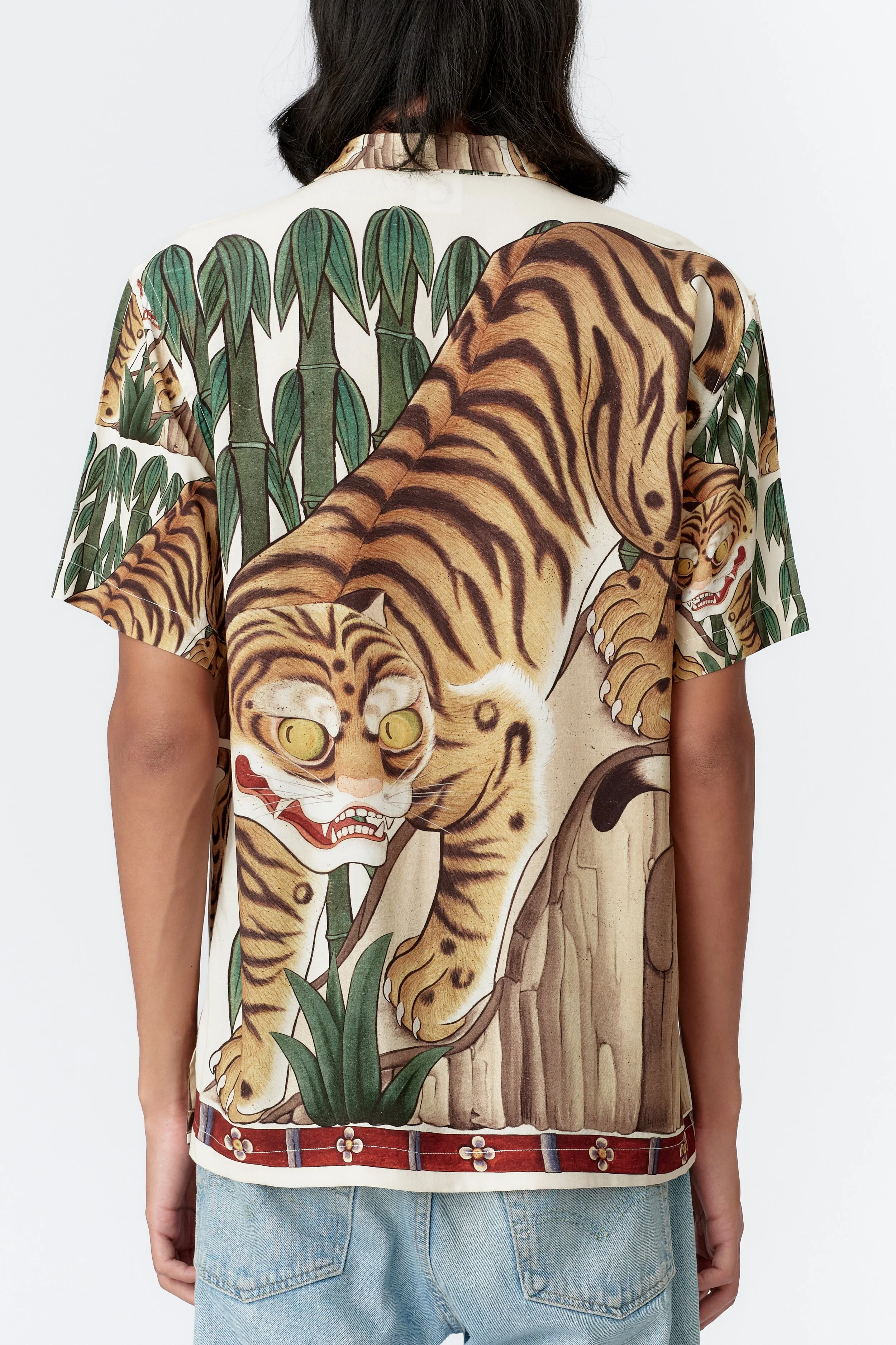 Back view of Tiger cream short sleeve shirt featuring large guardian tiger artwork