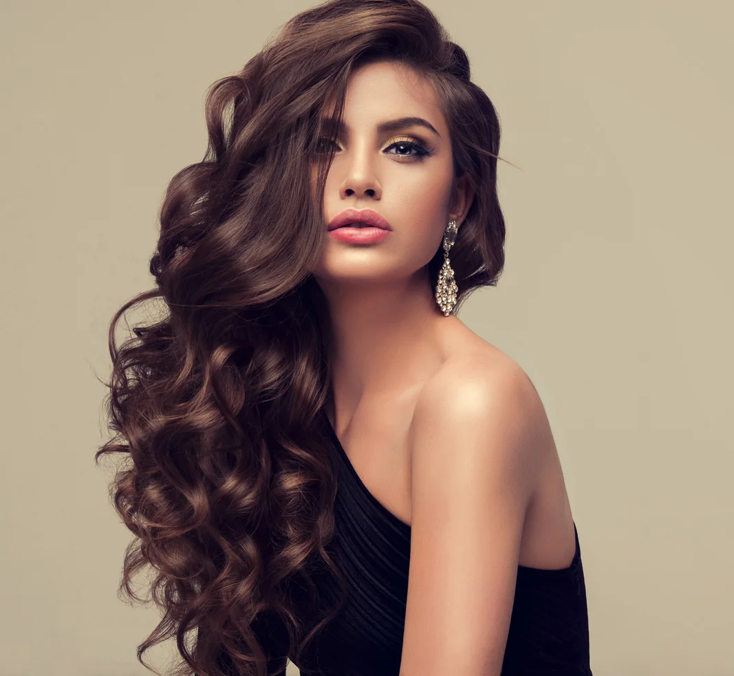 Young-attractive-brunette-with-voluminous,-shiny-and-curly-hairstyle.-692814140_1069x985.jpeg