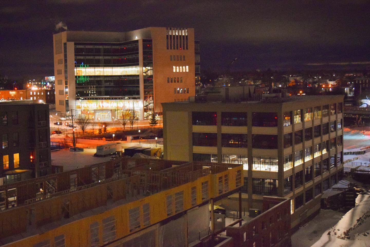 The new Lowell Justice Center, the UMass Lowell M2D2 Innovation Hub, and a new building under construction are visible in the Hamilton Canal Innovation District from the top of a new parking garage built as part of the district’s ongoing development. SUN/Robert Mills