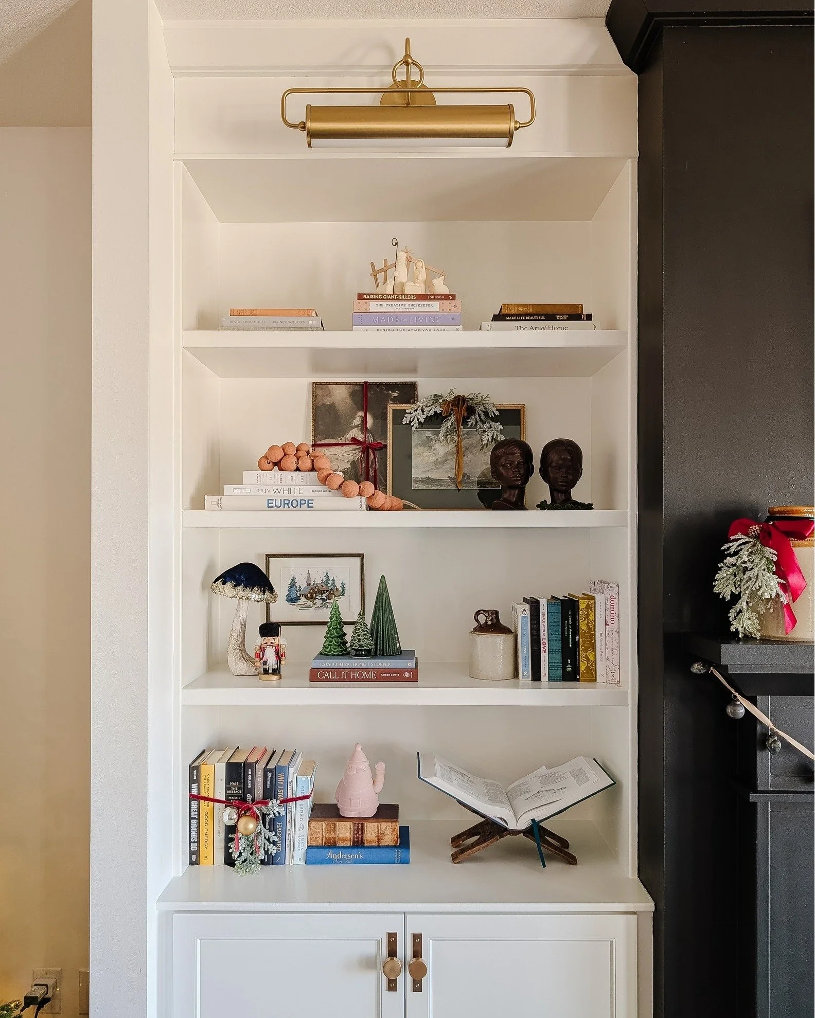 I got around to decorating my own house! I really liked the current set-up of my books and frames. So I just added things around and on what was there. They're pretty simple this time around, but I like them.
Things I added this year are sprigs, ribb