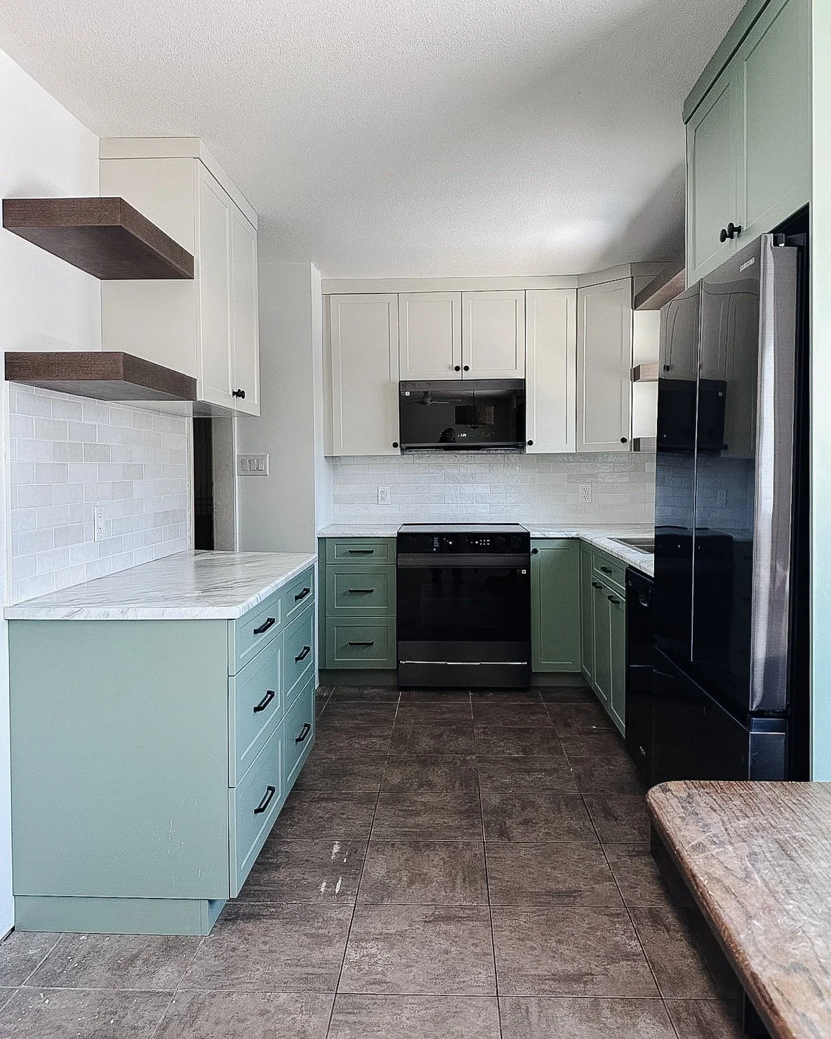 // BEFORE + AFTER // This kitchen feels so much bigger ad brighter after the renovation. The layout of the room changed a lot, but the actual space didn't change at all. We are very curious to find out, as the homeowner moves back into this part of t