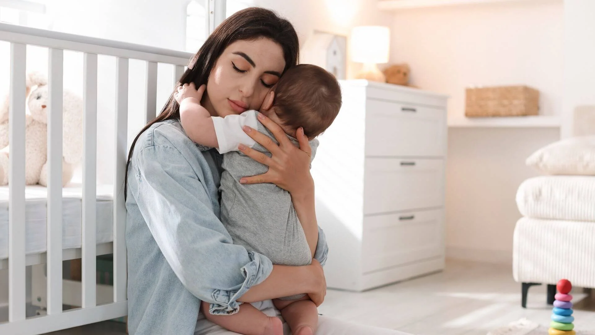 mother hugging their baby