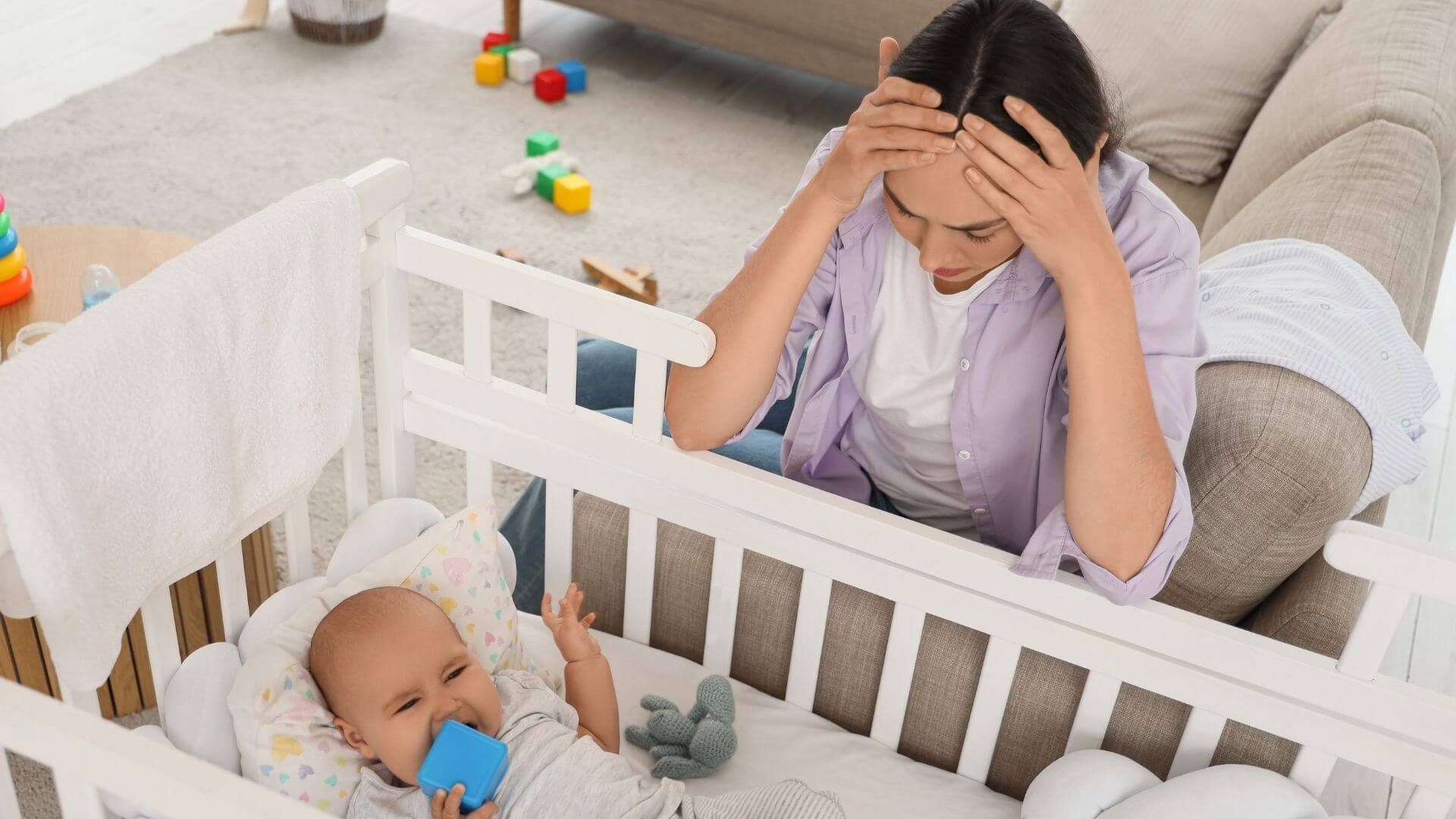 mother upset while caring for baby