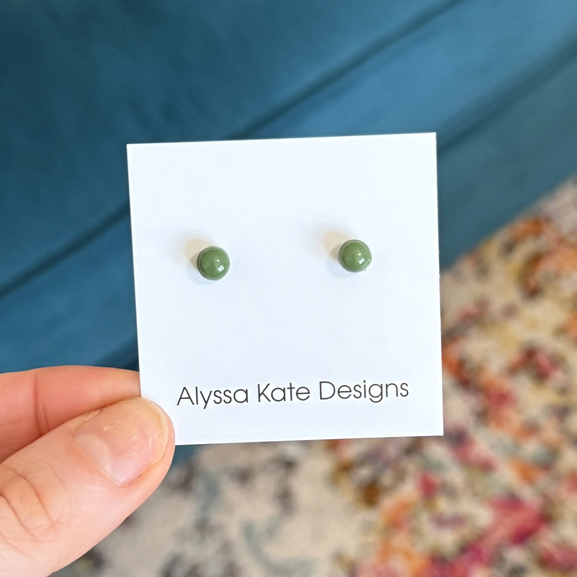 Wild Fern dark green polymer clay stud earrings displayed on Alyssa Kate Designs earring card
