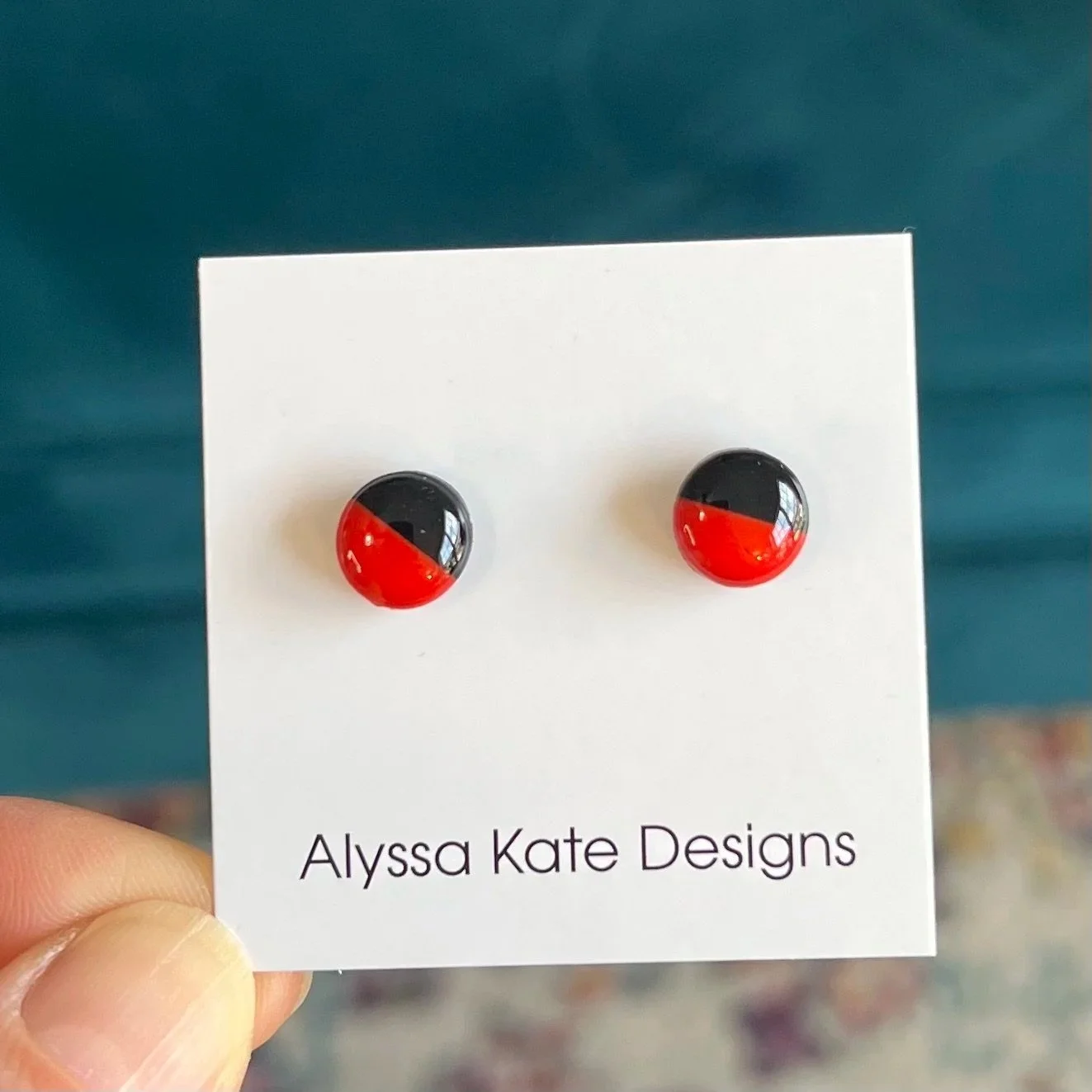Red and black handmade Game Day stud earrings with glossy resin finish