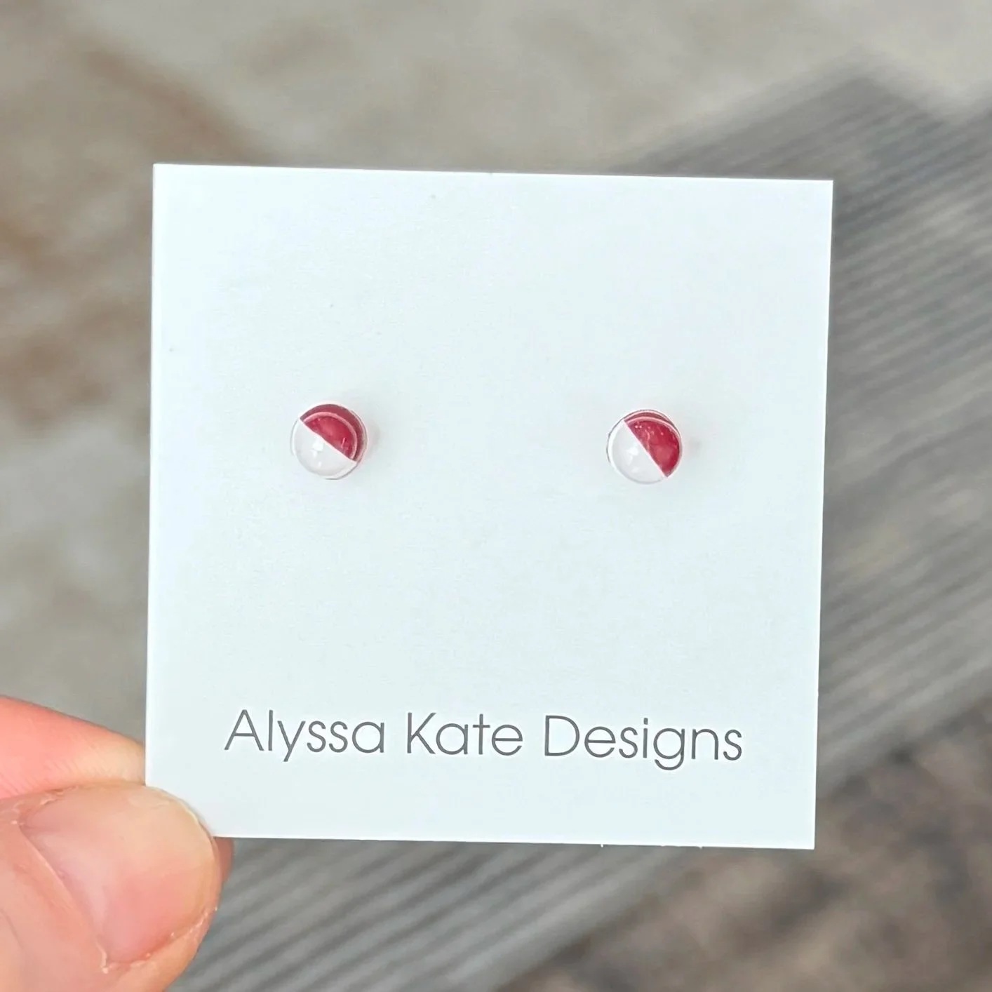 Crimson and white handmade polymer clay Game Day stud earrings in a petite size