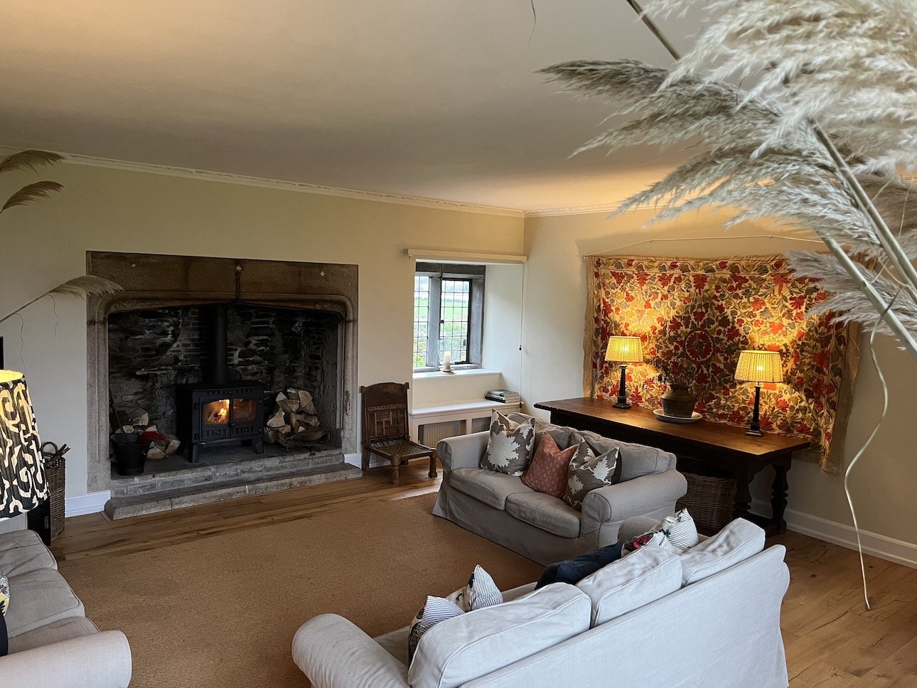 Erth Sitting Room with fire - view to St Germans low res.jpeg