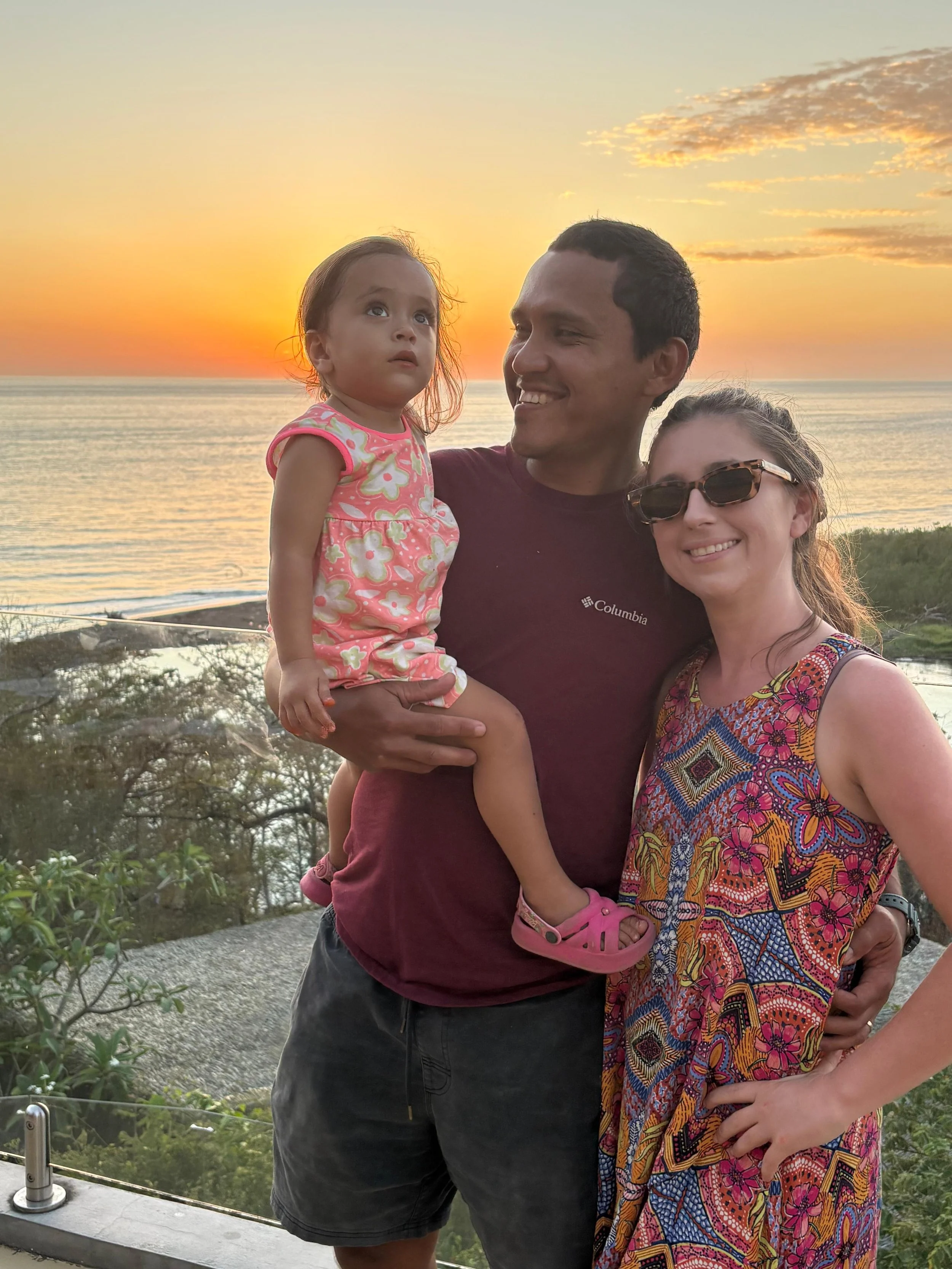 Family in front of beach sunset