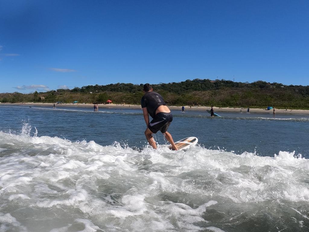 Man catches a wave in Playa Guiones