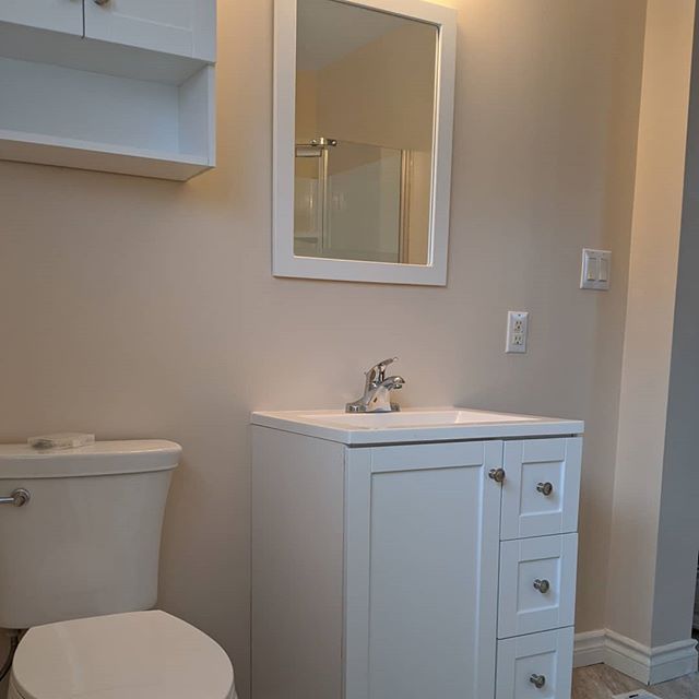 A recent cost efficient bathroom renovation with updated flooring, vanity, shower unit and paint job. Completed with a sliding barn door entryway. To update any space in your home, big or small, contact Classic Home Improvements today at 519-752-6431