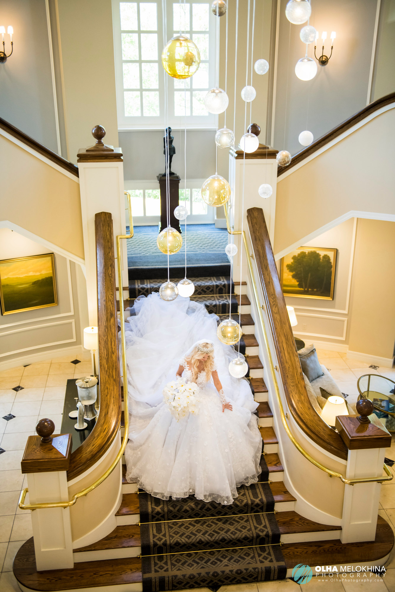 The bride making her way downstairs to take a glimpse at the setup for her big day.