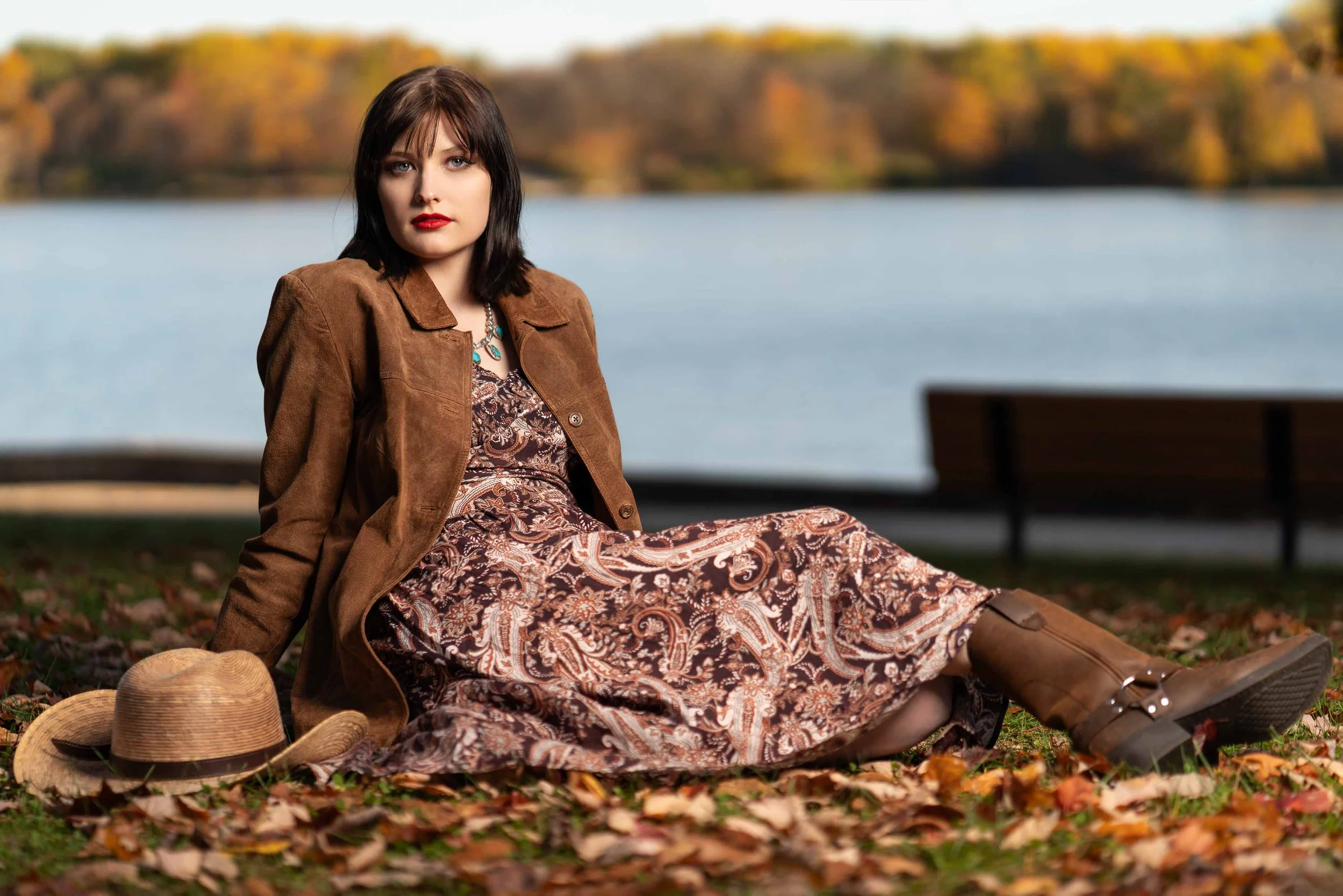 Boho-style autumn senior portrait at a park in South Bend, Indiana, with lake views.