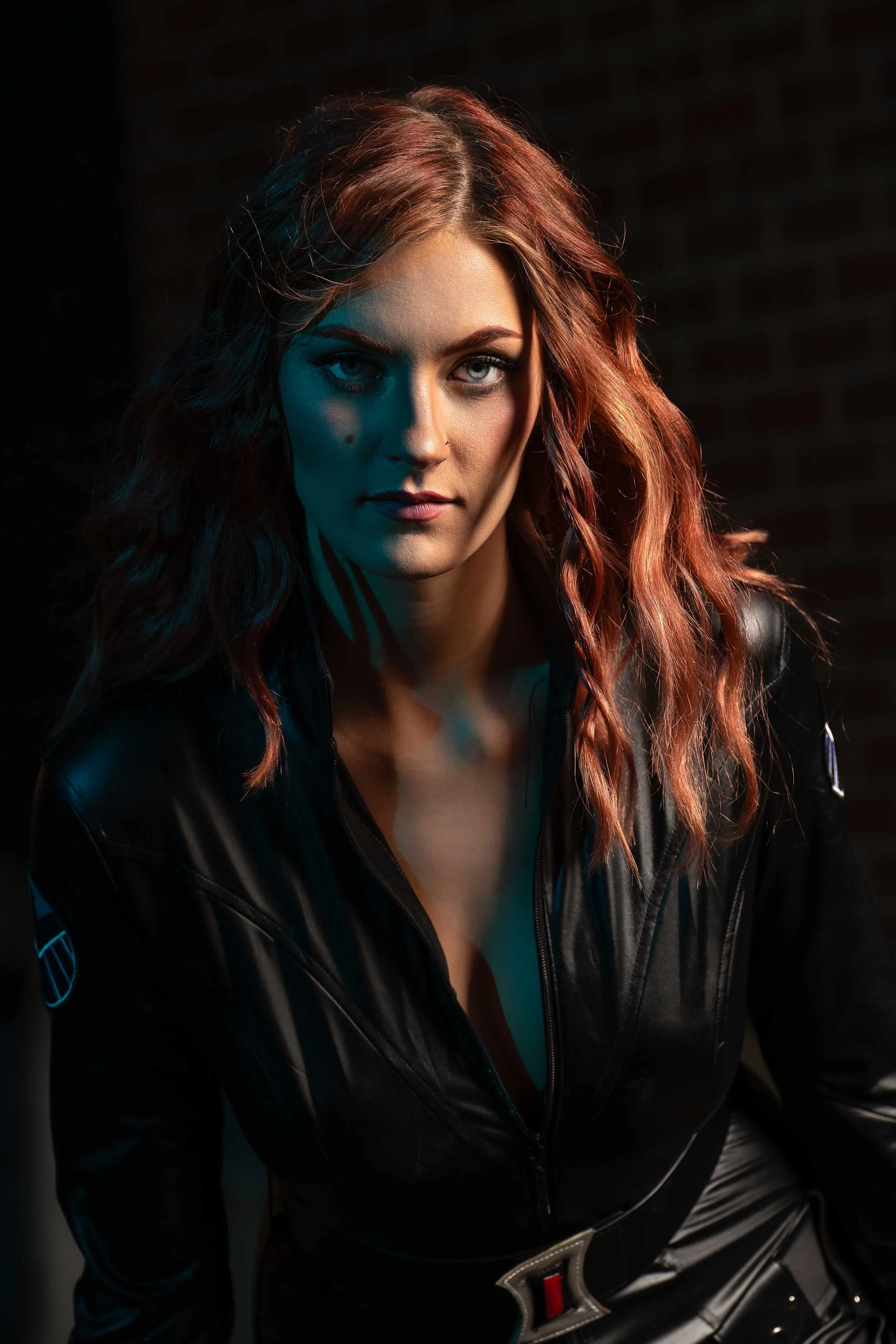 Cinematic cosplay portrait photography in Northern Indiana featuring a Black Widow Marvel theme.