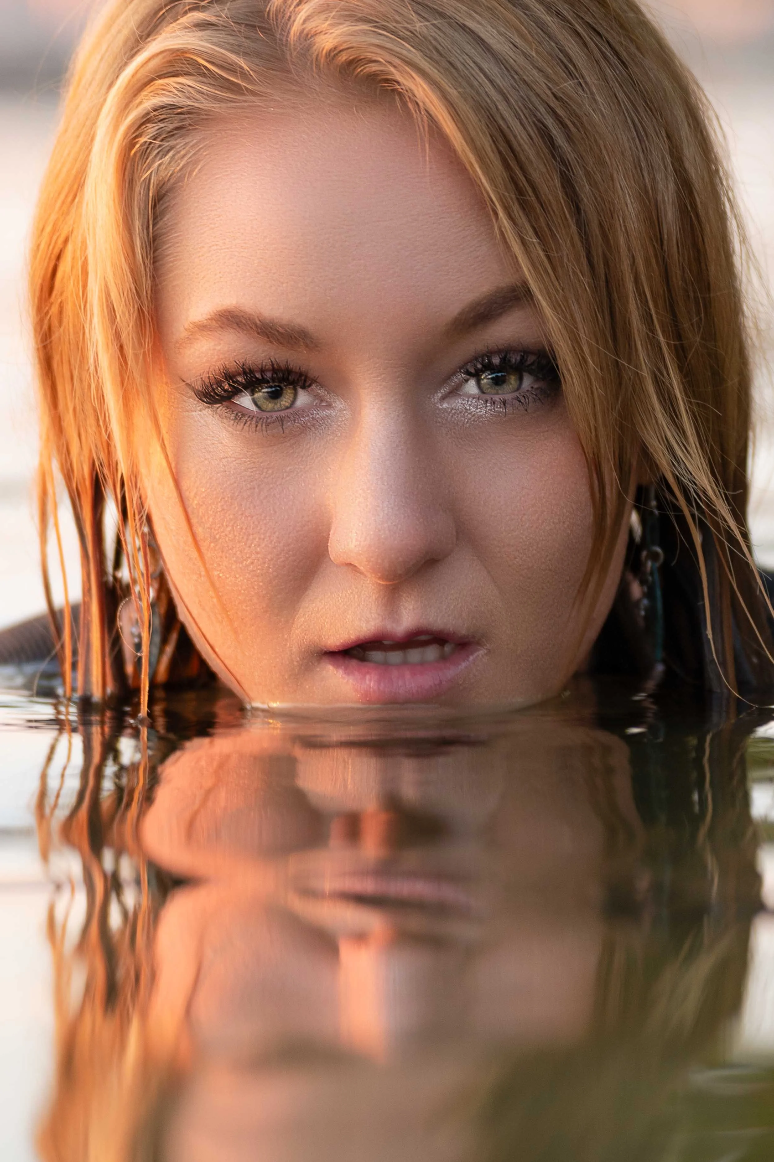 Artistic water portrait of a woman at sunset by a South Bend photographer serving Northern Indiana.