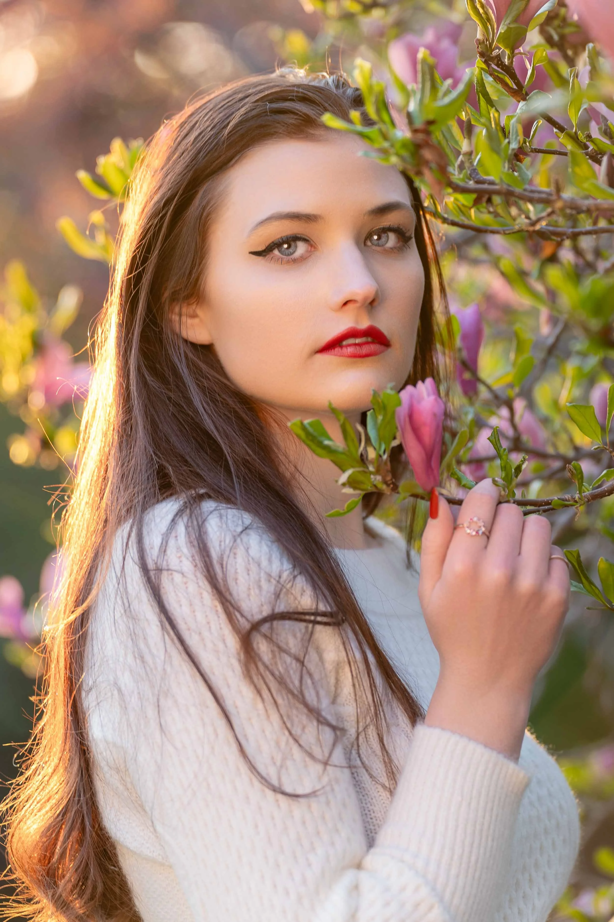 Professional outdoor headshot in Southern Michigan featuring natural lighting and floral background by a South Bend photographer.