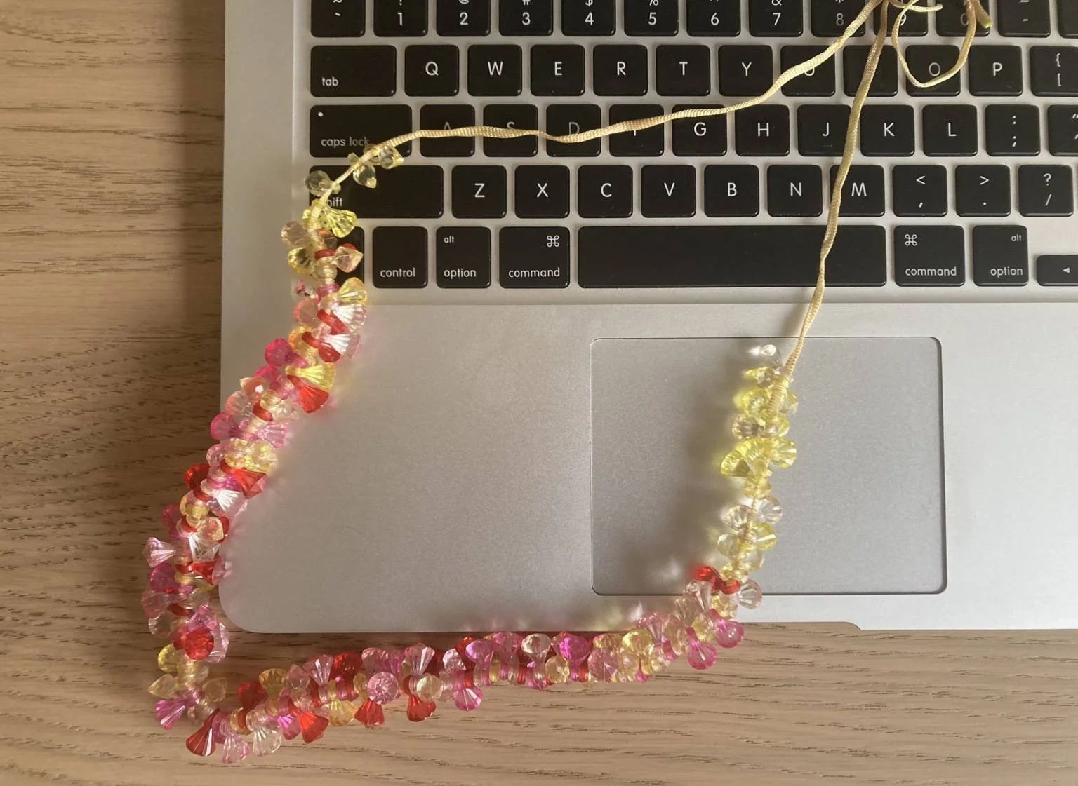 Child-created beaded jewellery made collaboratively during an online Play Therapy session between therapist in Bangalore and child in Singapore