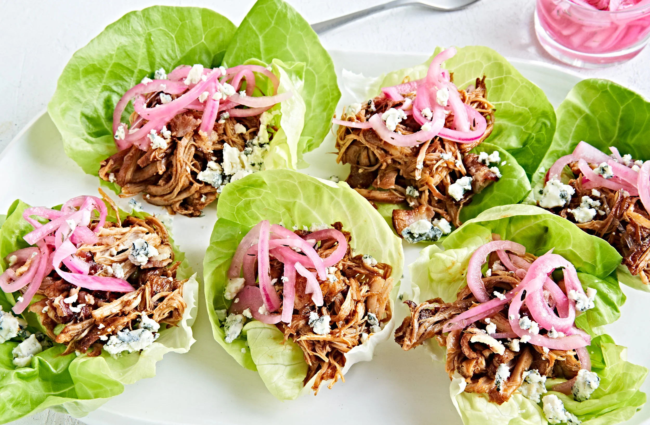 Instant pot pulled chicken in lettuce cups with pickled onions