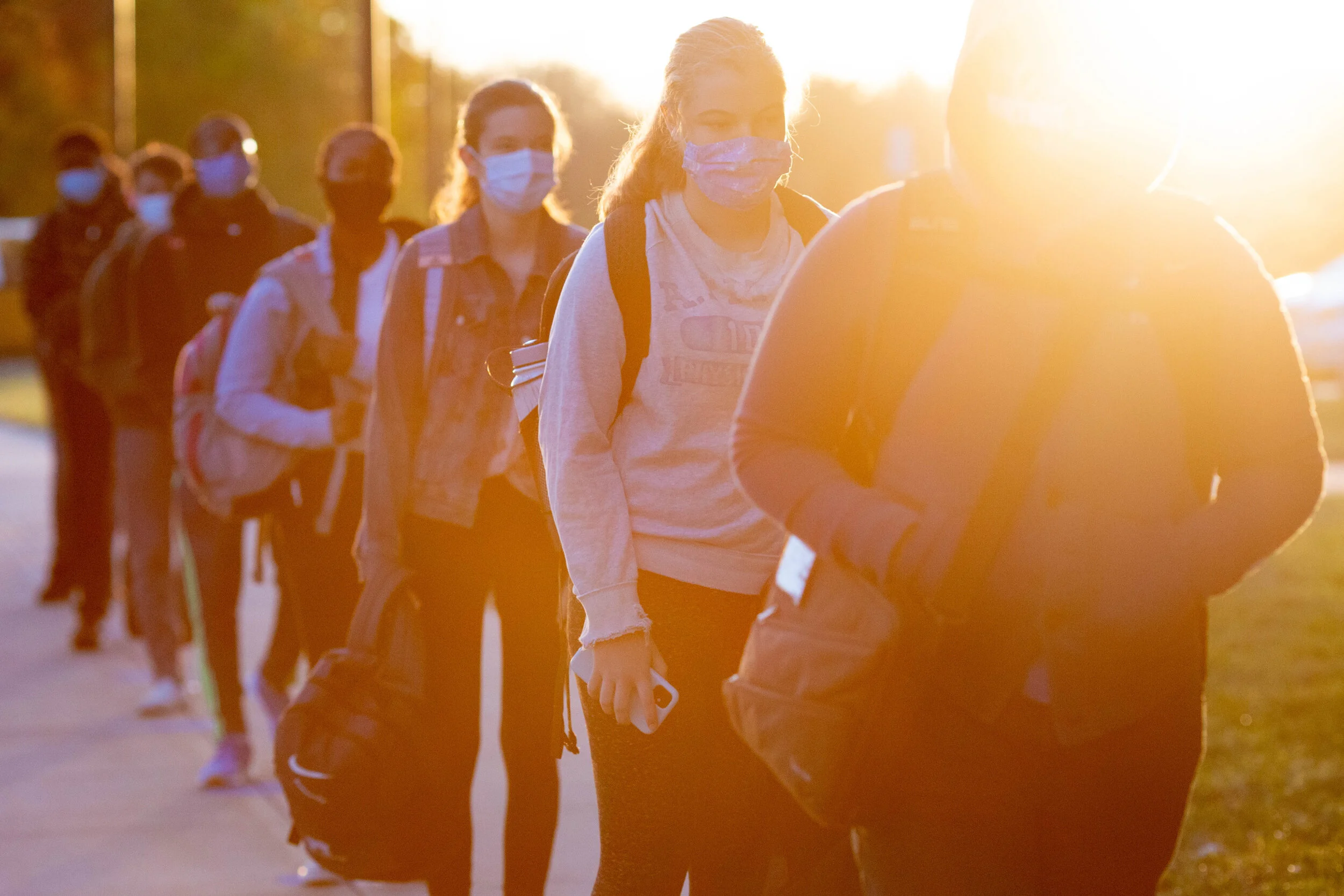 Why are some students ignoring government guidelines and returning to university?