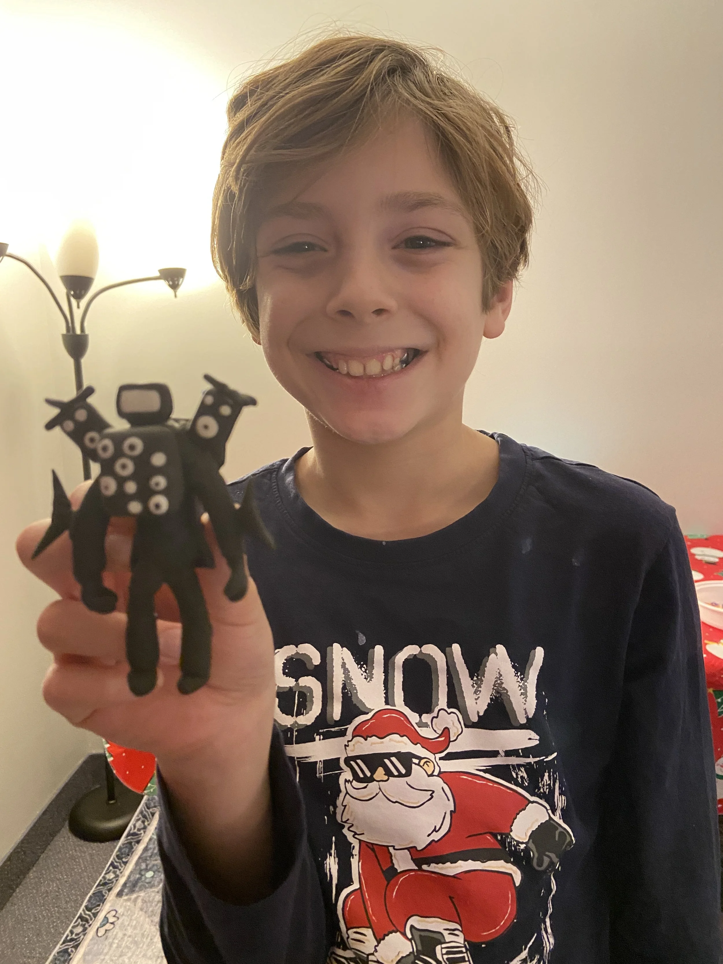 A talented Cartoon Camp student shows off his sculpted character at Cartoon Camp in Barrie, ON