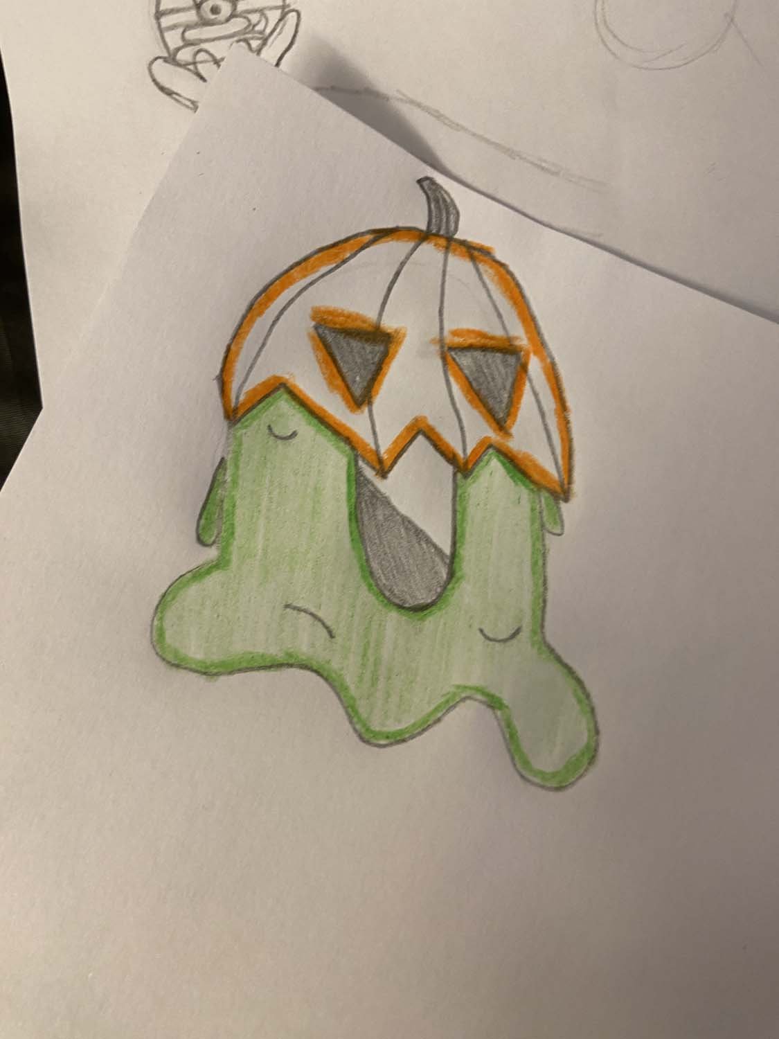 A slime creature with a fancy pumpkin hat drawn by a student in Upchuckle Education's art classes, in Barrie Ontario