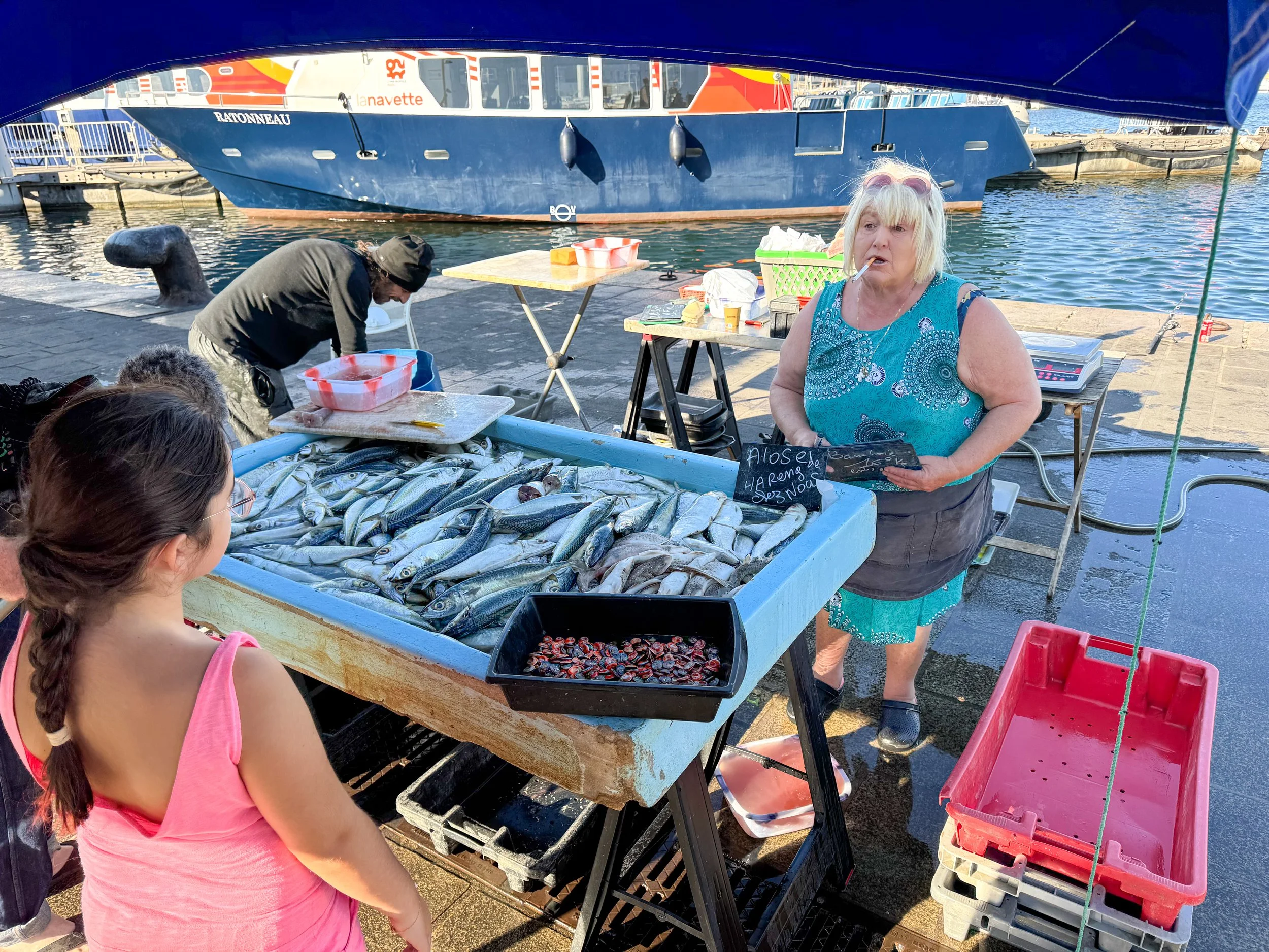 Lady selling fish on the old port