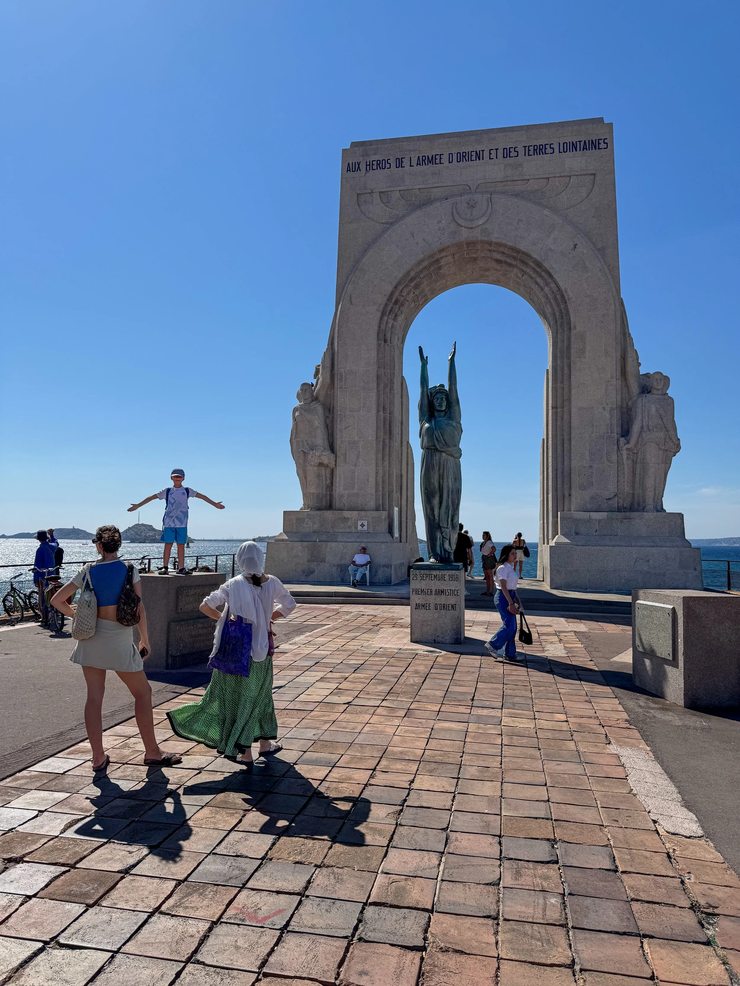  Monument to the heroes of the army of the orient and faraway places. It looks like the boy and the statue are doing the YMCA dance.  