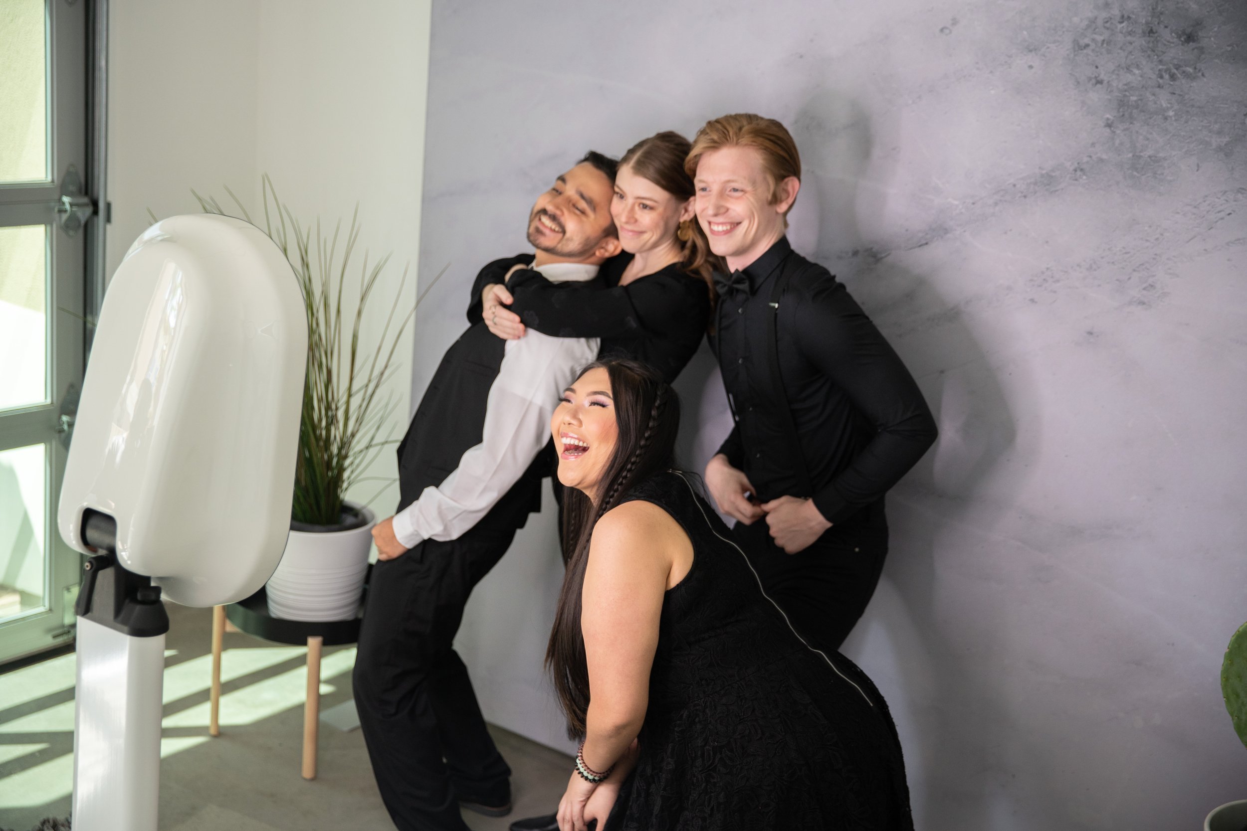 Wedding photo booth in Raleigh NC", "Guests using photo booth at Raleigh wedding reception