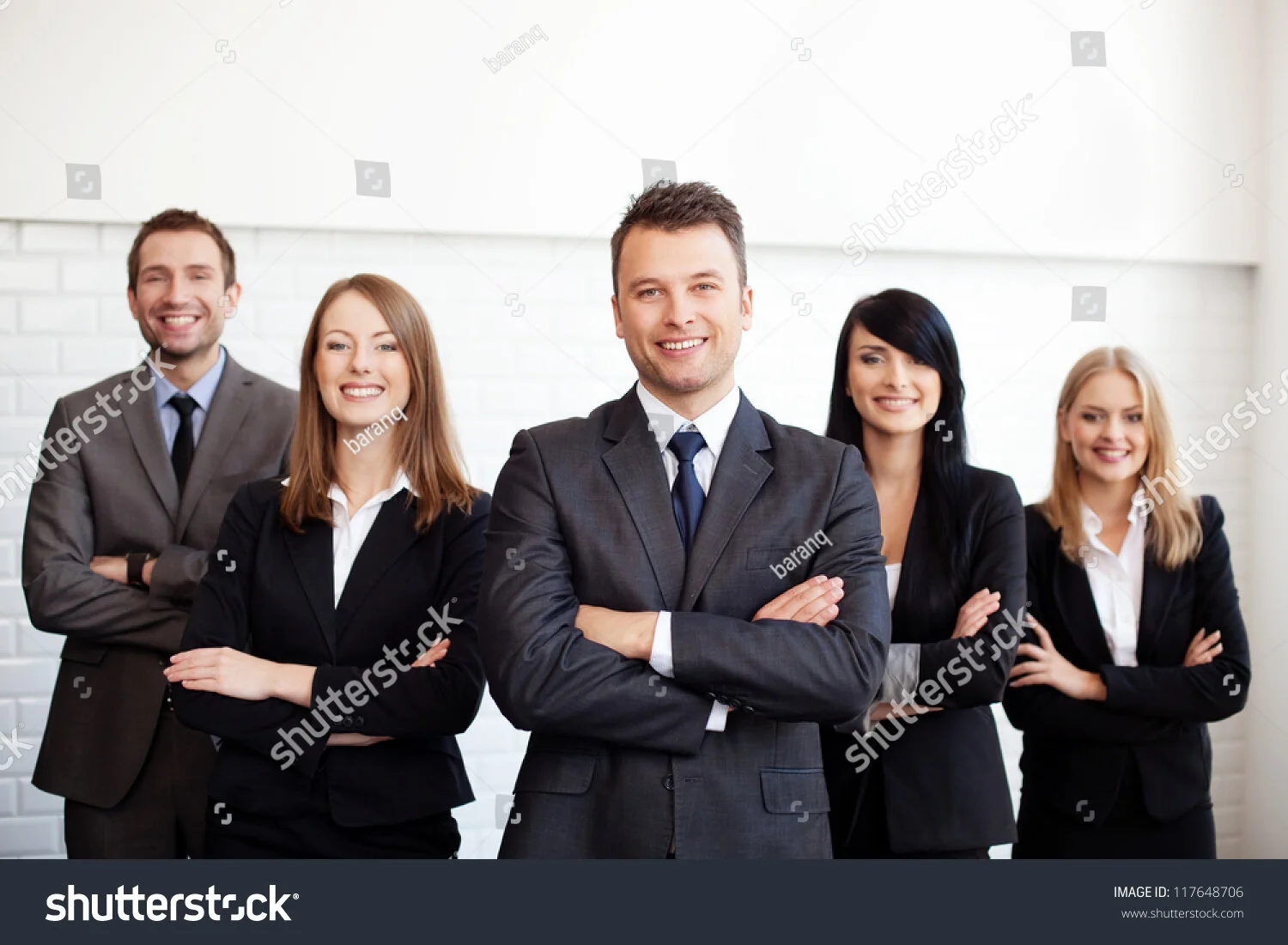 stock-photo-group-of-business-people-with-businessman-leader-on-foreground-117648706.jpg
