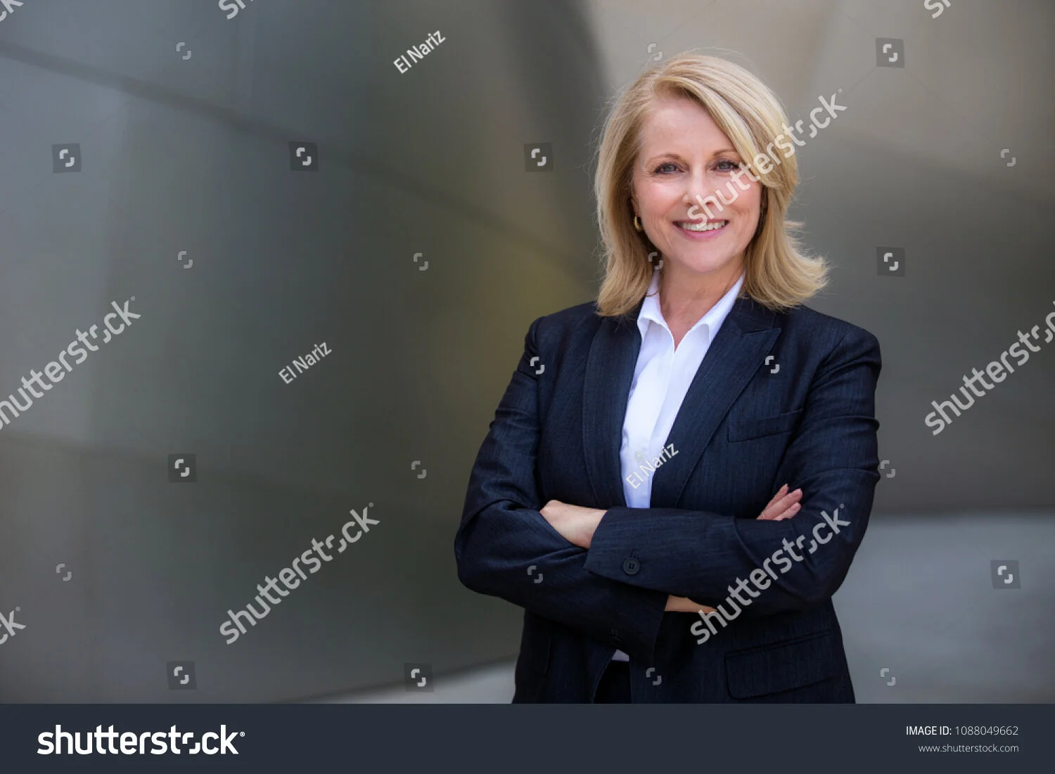 stock-photo-pretty-older-business-woman-successful-confidence-with-arms-crossed-in-financial-building-1088049662.jpg