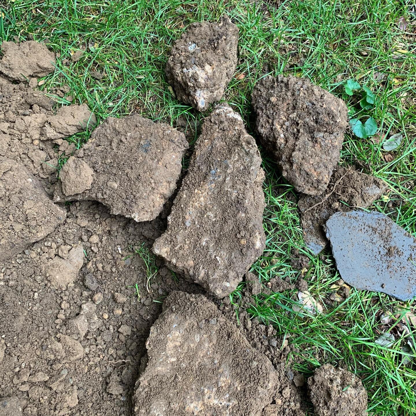 Decommissioned/crushed septic tank. 

Found an area of concern in the backyard up in Oradell. It was in line with the waste line and we suspected that it was possibly an old septic tank since they were common in this area. 

When we dug down we insta