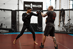 Kyran trains striking techniques with coach Lyndon Whitlock at Para Bellum MMA.(Credit: Patrick Duffy)