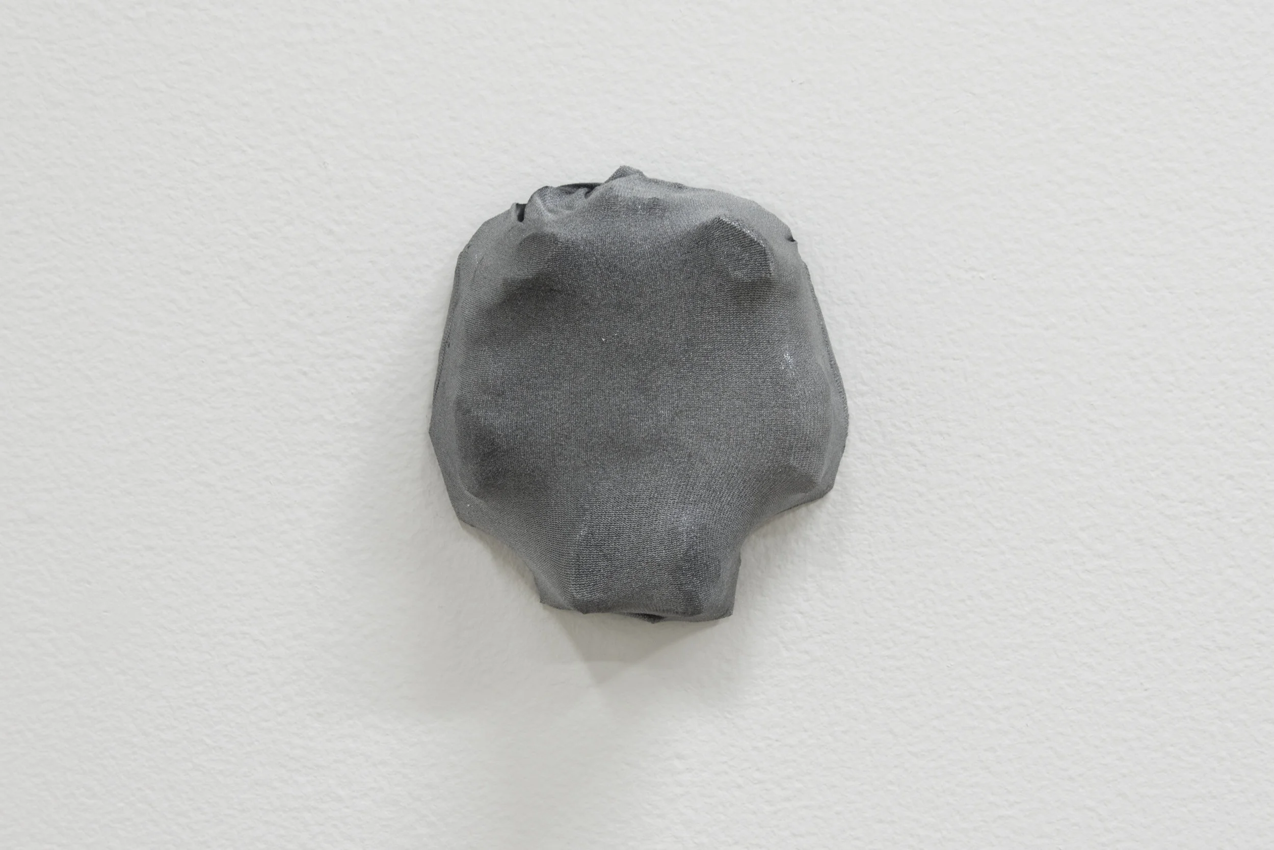 Sara Hubbs, Small Boys , 2018, no show nylon liner socks and spray paint over plastic toy container