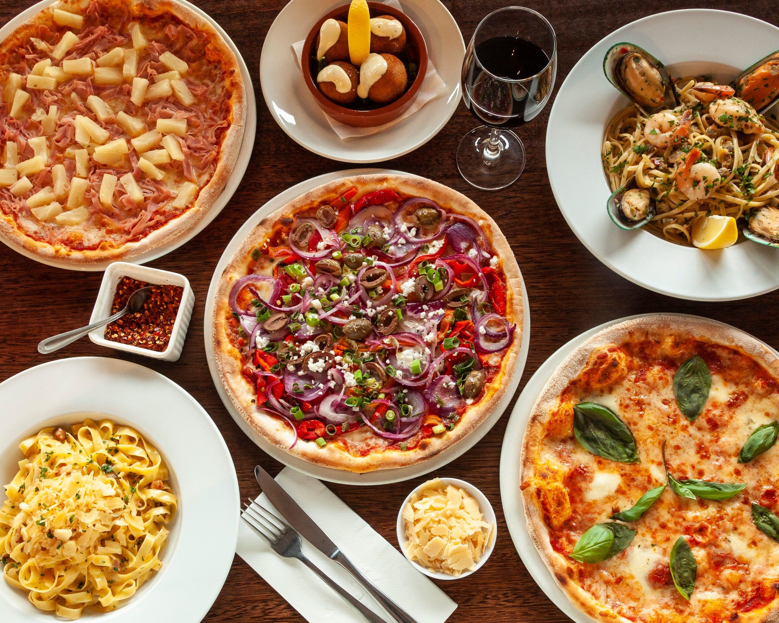 Pizza alongside other foods
