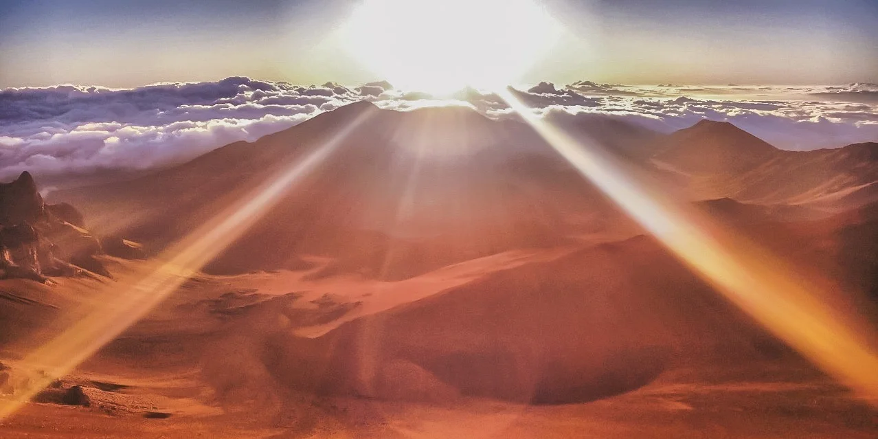 The Sun rising over Haleakalā, Maui, Hawaii