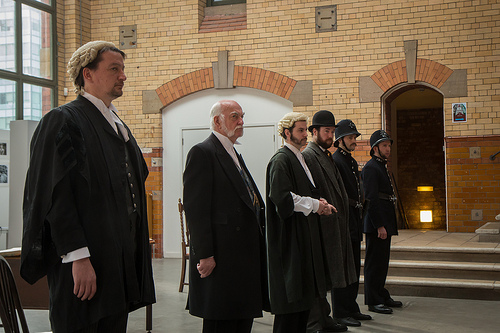 MARTIN GREEN AS MR COBBETT, JOHN SMEATHERS AS MAGISTRATE RICKARDS, GRAHAM EAGLESHAM AS MR NASH, MARK ROBERTS AS JEROME CAMINADA AND TWO CONSTABLES (GARETH GEORGE AND DAN JARVIS) (LEFT TO RIGHT)