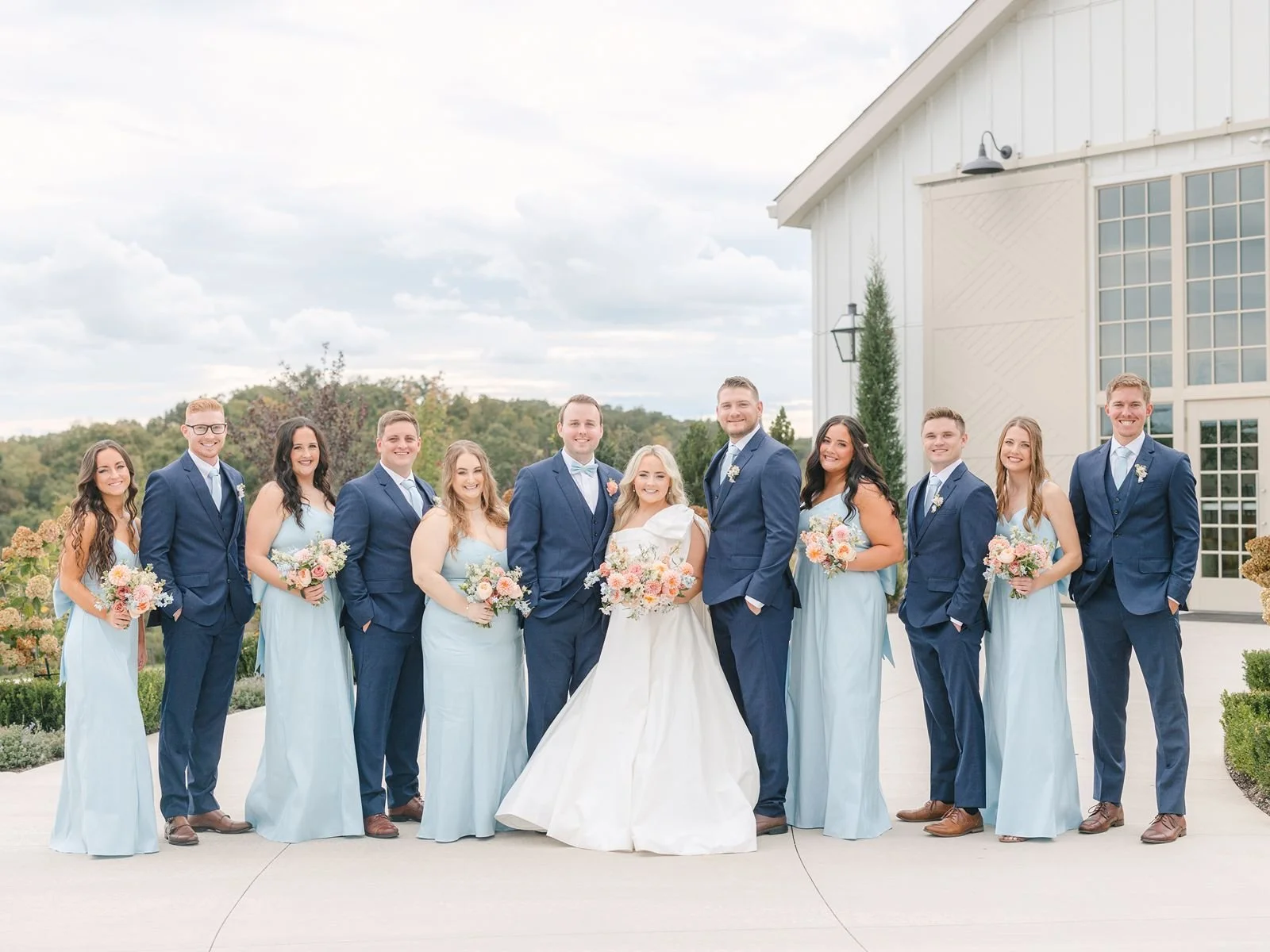 Wedding party poses on the patio at Westwind Hills