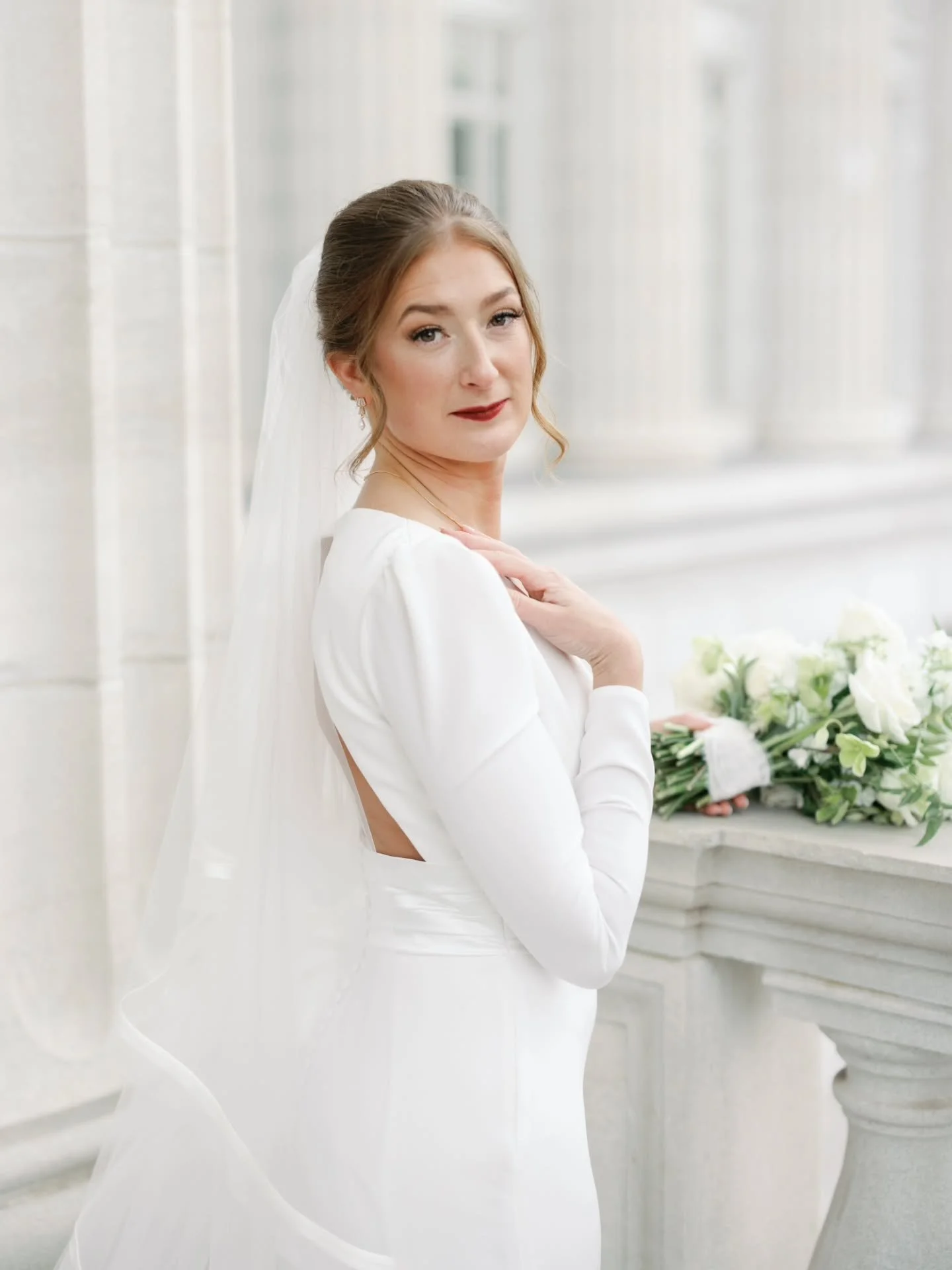 Engaged at the Empire State Building. A dress chosen at Kleinfeld&rsquo;s. And a bridal look that was the perfect blend of iconic and modern &mdash; a regal gown with a plunging neckline, simple jewelry, a bold lip, her hair pulled back, an all-white