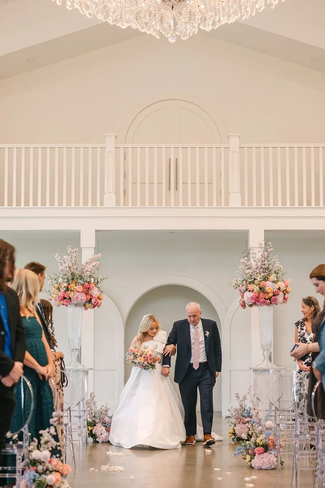 Bride walks down aisle with father at Westwind Hills wedding ceremony