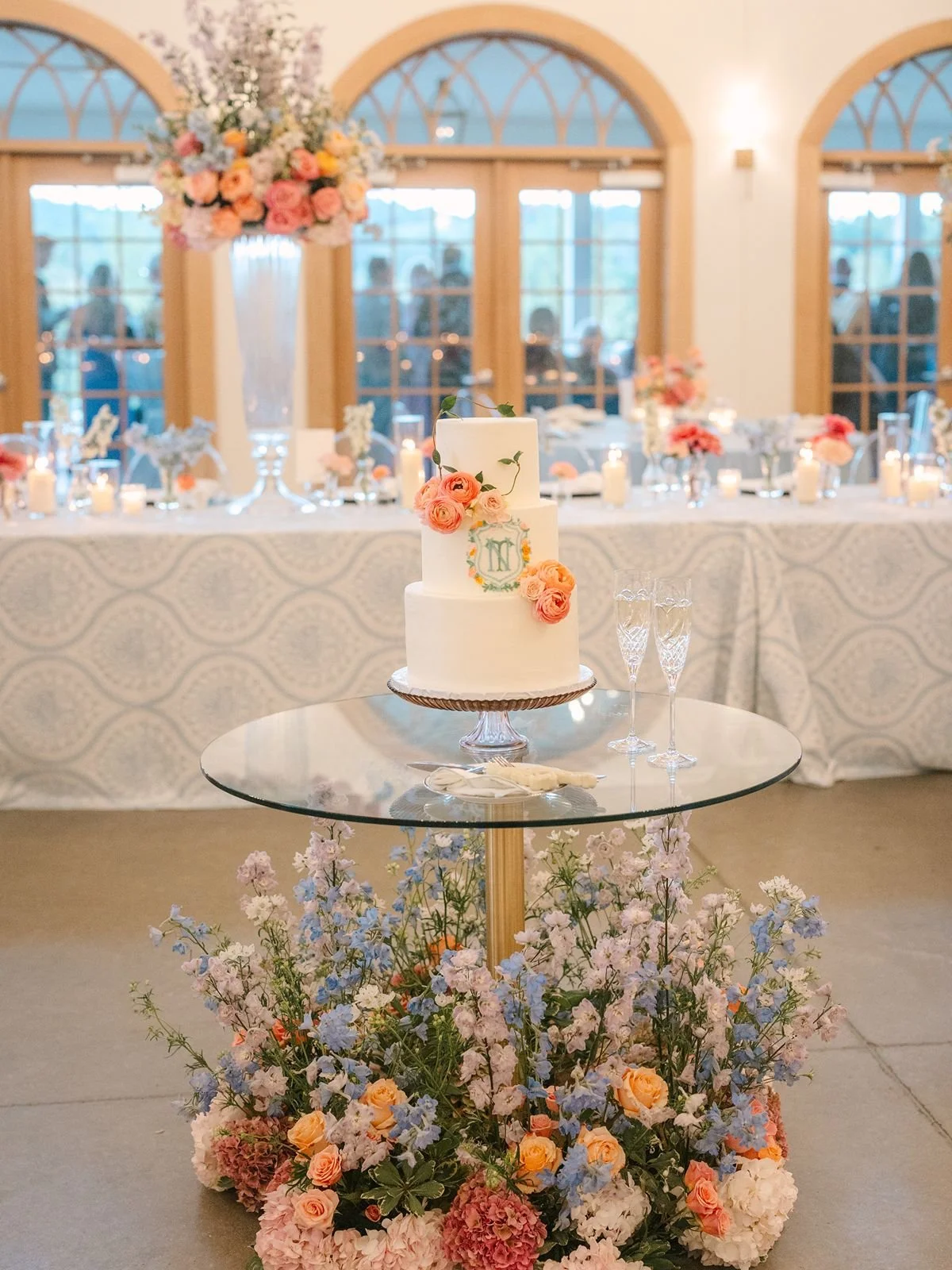 Wedding cake table with colorful flowers