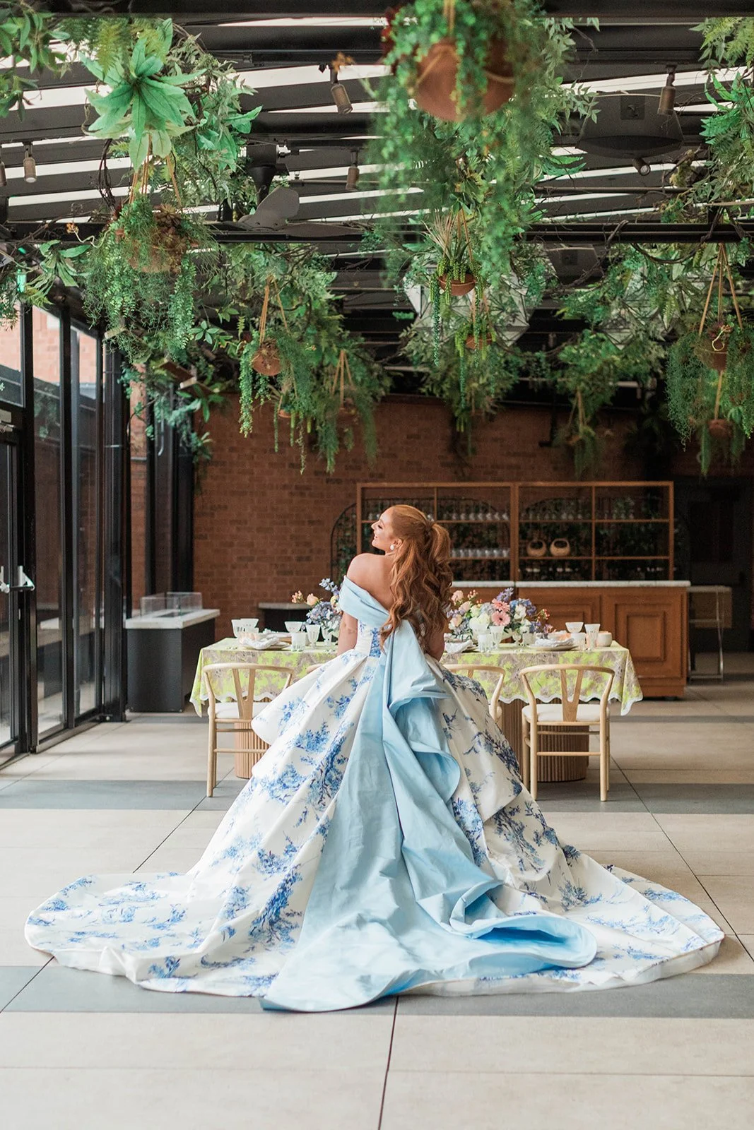 Bride posing in white and blue wedding gown at Ritz Carlton St Louis