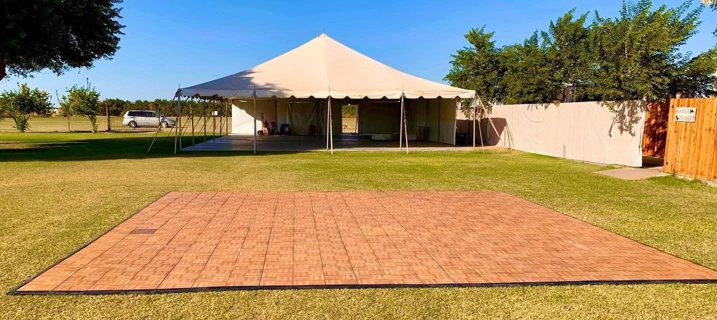 Outdoor dance floor ready for a wedding celebration.
